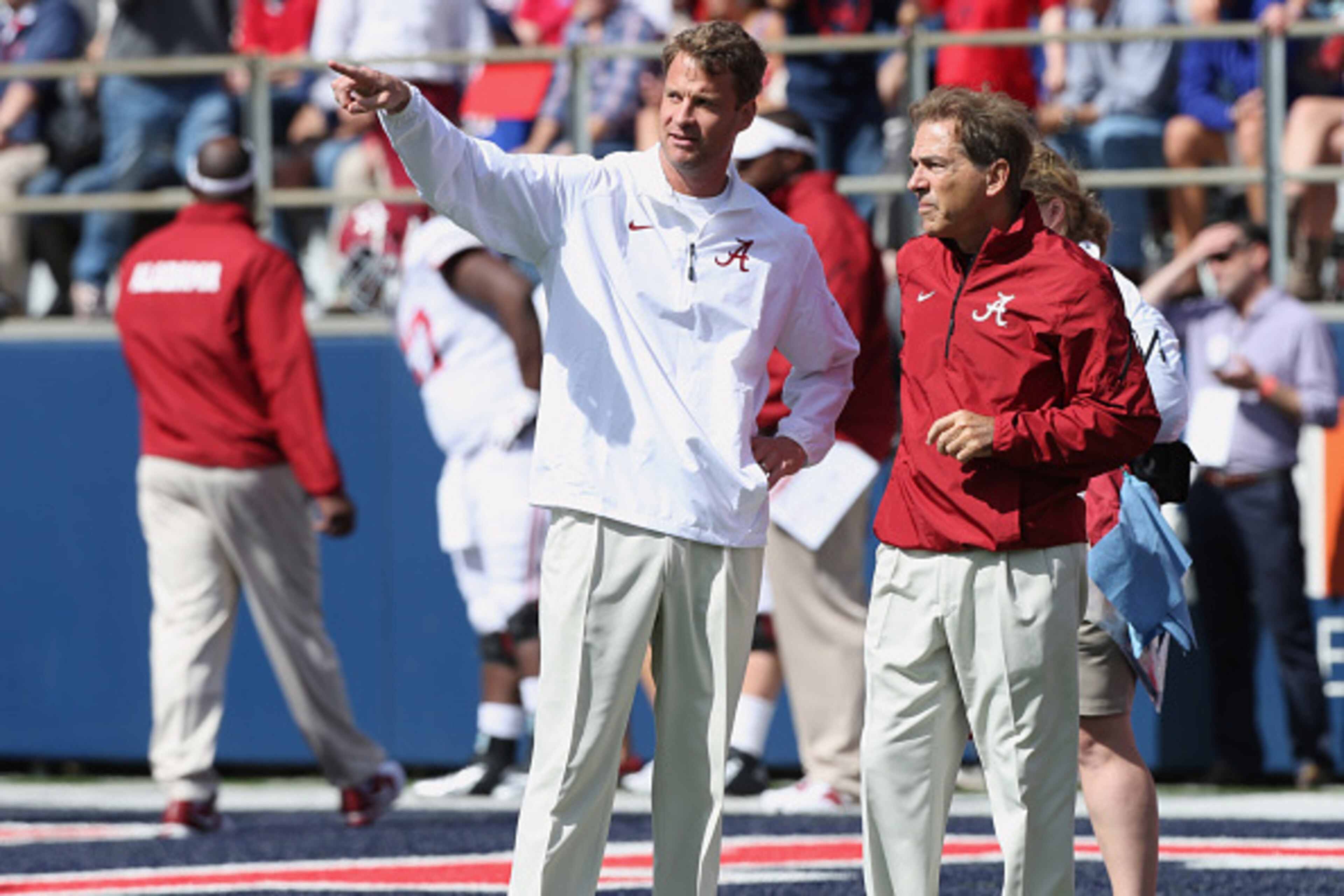 OXFORD, MS - OCTOBER 4: Nick Saban, head coach of the Alabama Crimson Tide talks with Lane Kiffin, offensive coordinator of the Alabama Crimson Tide during warmups before a game against the Ole Miss Rebels on October 4, 2014 at Vaught-Hemingway Stadium in
