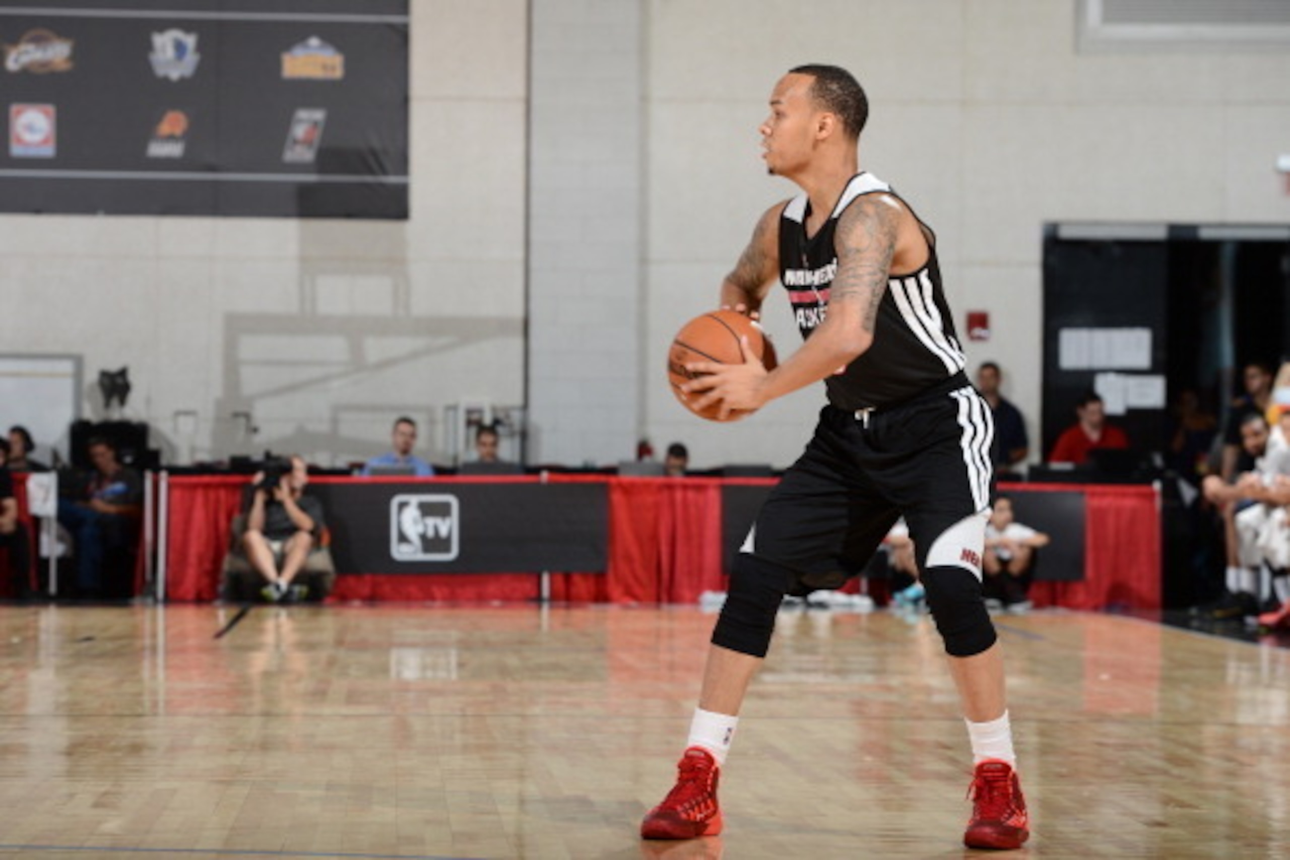 LAS VEGAS, NV - JULY 17:  Shabazz Napier #13 of the Miami Heat looks to pass against the Washington Wizards on July 17, 2014 at the Cox Pavilion in Las Vegas, Nevada. NOTE TO USER: User expressly acknowledges and agrees that, by downloading and or using t