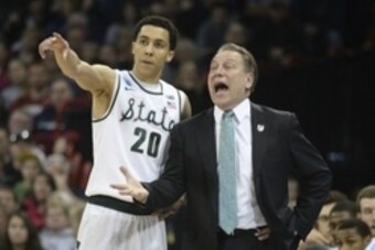 Mar 22, 2014; Spokane, WA, USA; Michigan State Spartans head coach Tom Izzo (right) instructs guard Travis Trice (20) against the Harvard Crimson in the second half of a men's college basketball game during the third round of the 2014 NCAA Tournament at V