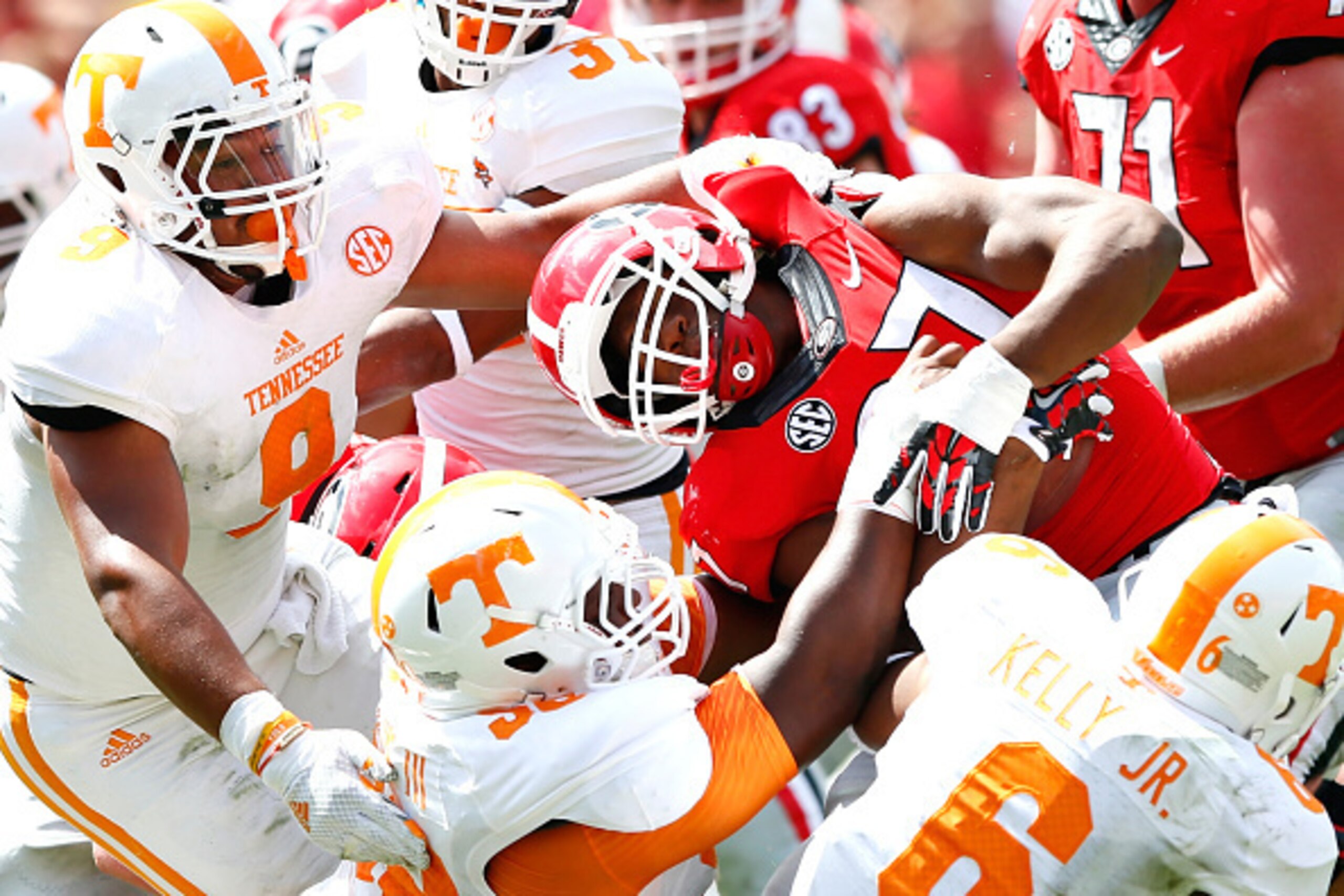 ATHENS, GA - SEPTEMBER 27:  Owen Williams #58 of the Tennessee Volunteers is flagged for a facemask penalty as Williams, Derek Barnett #9 and Todd Kelly Jr. #6 of the Tennessee Volunteers tackle Nick Chubb #27 of the Georgia Bulldogs at Sanford Stadium on