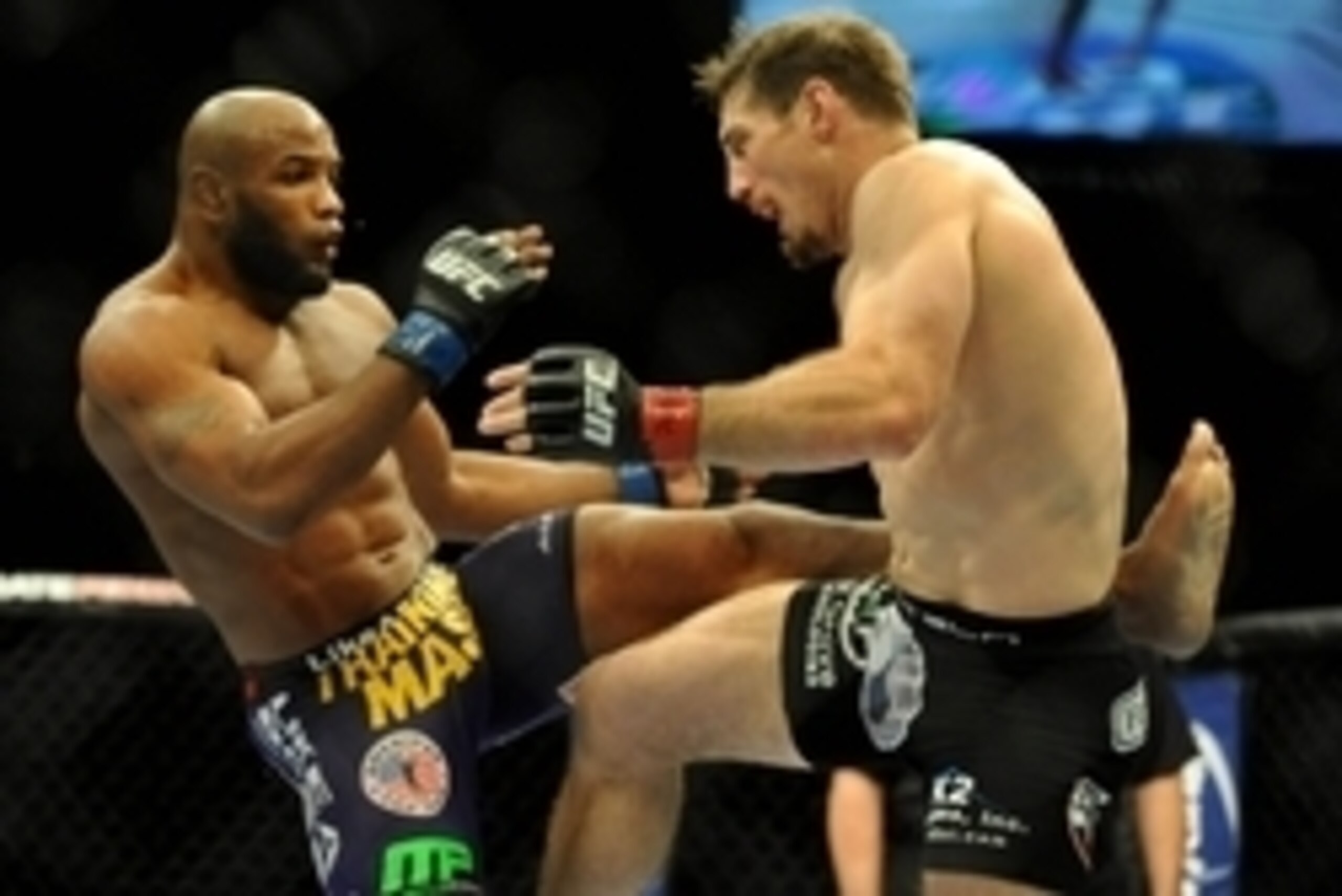 Sep 27, 2014; Las Vegas, NV, USA; Yoel Romero (blue gloves) fights Tim Kennedy (red gloves) during a middleweight fight during UFC 178 at MGM Grand Garden Arena. Mandatory Credit: Stephen R. Sylvanie-USA TODAY Sports