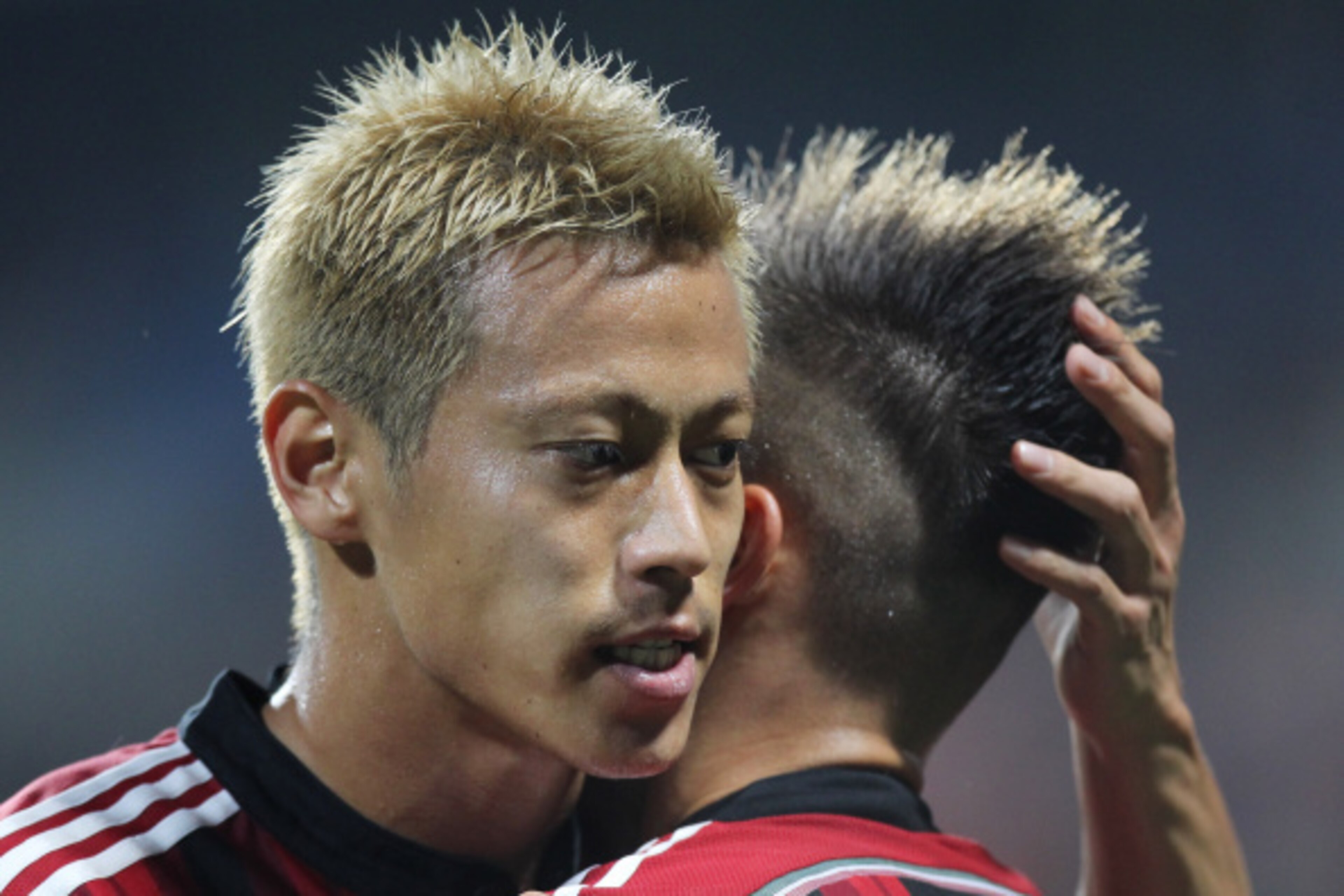 REGGIO NELL'EMILIA, ITALY - AUGUST 23: Stephan El Shaarawy with his teammate Keisuke Honda (L) of AC Milan celebrates after scoring the second team's goal during the TIM Preseason Tournament between US Sassuolo, FC Juventus and AC Milan at Mapei Stadium REGGIO NELL'EMILIA, ITALY - AUGUST 23: Stephan El Shaarawy with his teammate Keisuke Honda (L) of AC Milan celebrates after scoring the second team's goal during the TIM Preseason Tournament between US Sassuolo, FC Juventus and AC Milan at Mapei Stadium