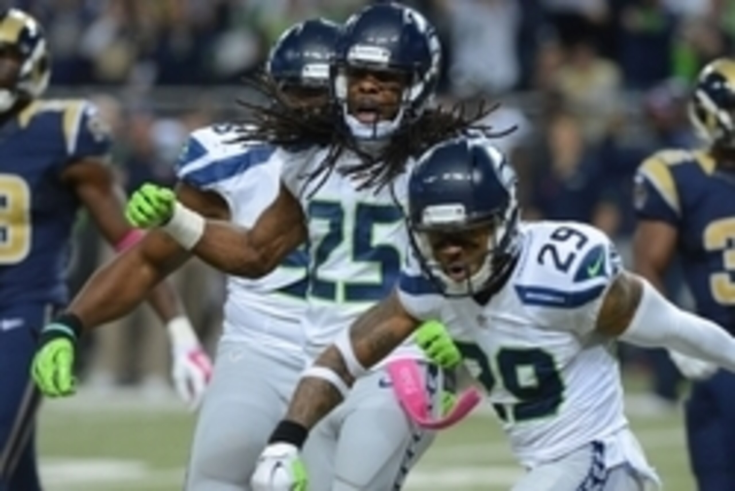 Oct 19, 2014; St. Louis, MO, USA; Seattle Seahawks cornerback Richard Sherman (25) celebrates with free safety Earl Thomas (29) after blocking a pass during the second half at the Edward Jones Dome. St. Louis defeated Seattle 28-26. Mandatory Credit: Jeff