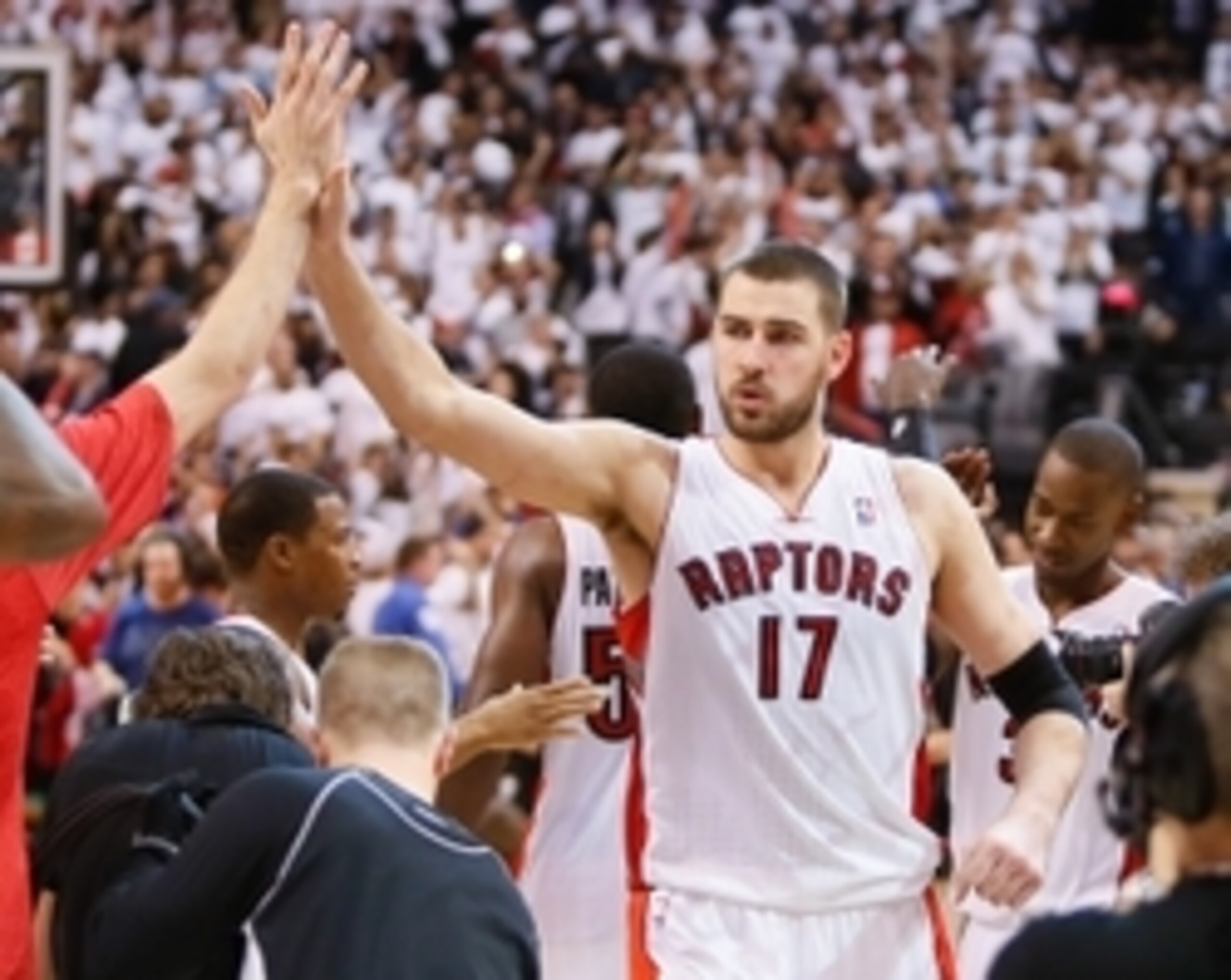 Apr 30, 2014; Toronto, Ontario, CAN; Toronto Raptors center Jonas Valanciunas (17) celebrates a win against the Brooklyn Nets in game five of the first round of the 2014 NBA Playoffs at the Air Canada Centre. Toronto defeated Brooklyn 115-113. Mandatory C