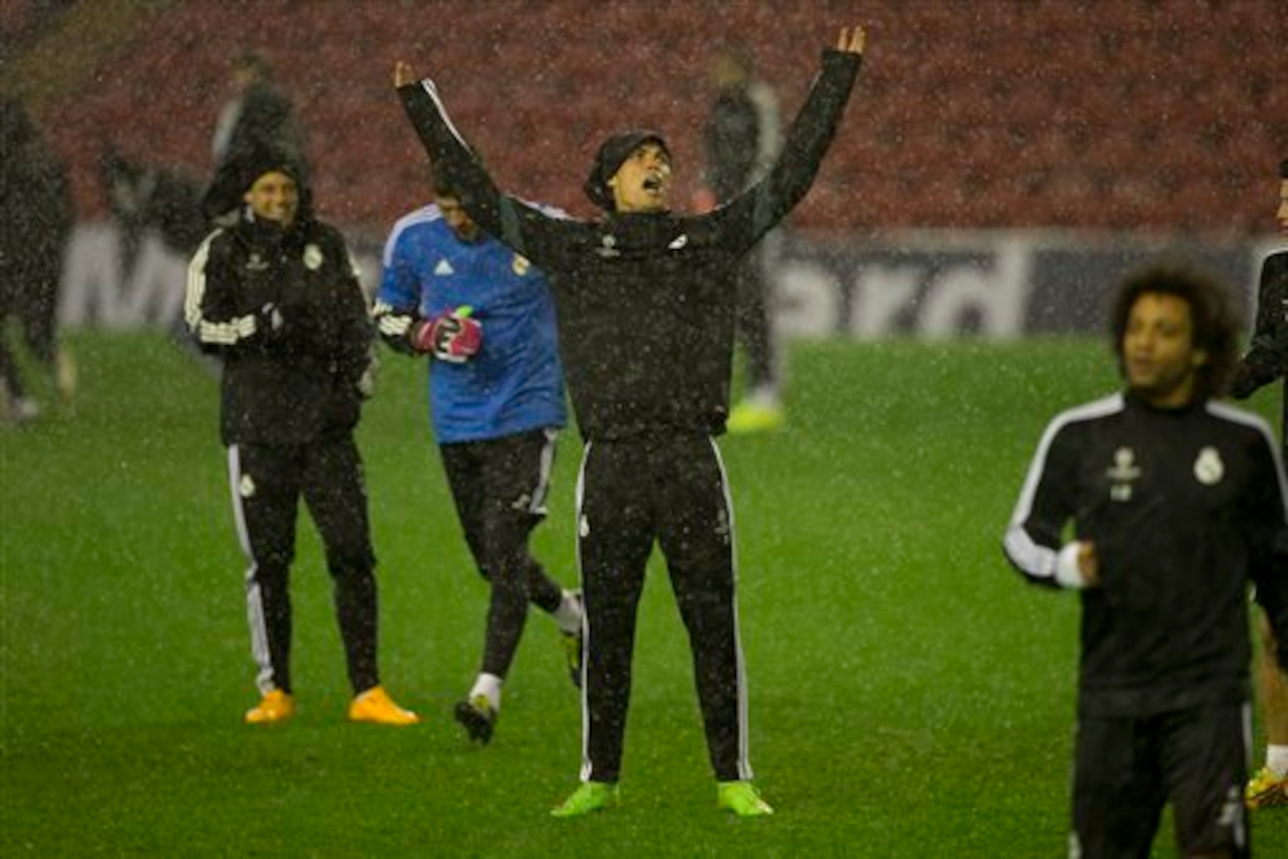 Ronaldo and his team-mates training at Anfield during Hurricane Gonzalo on Tuesday night. Ronaldo and his team-mates training at Anfield during Hurricane Gonzalo on Tuesday night.