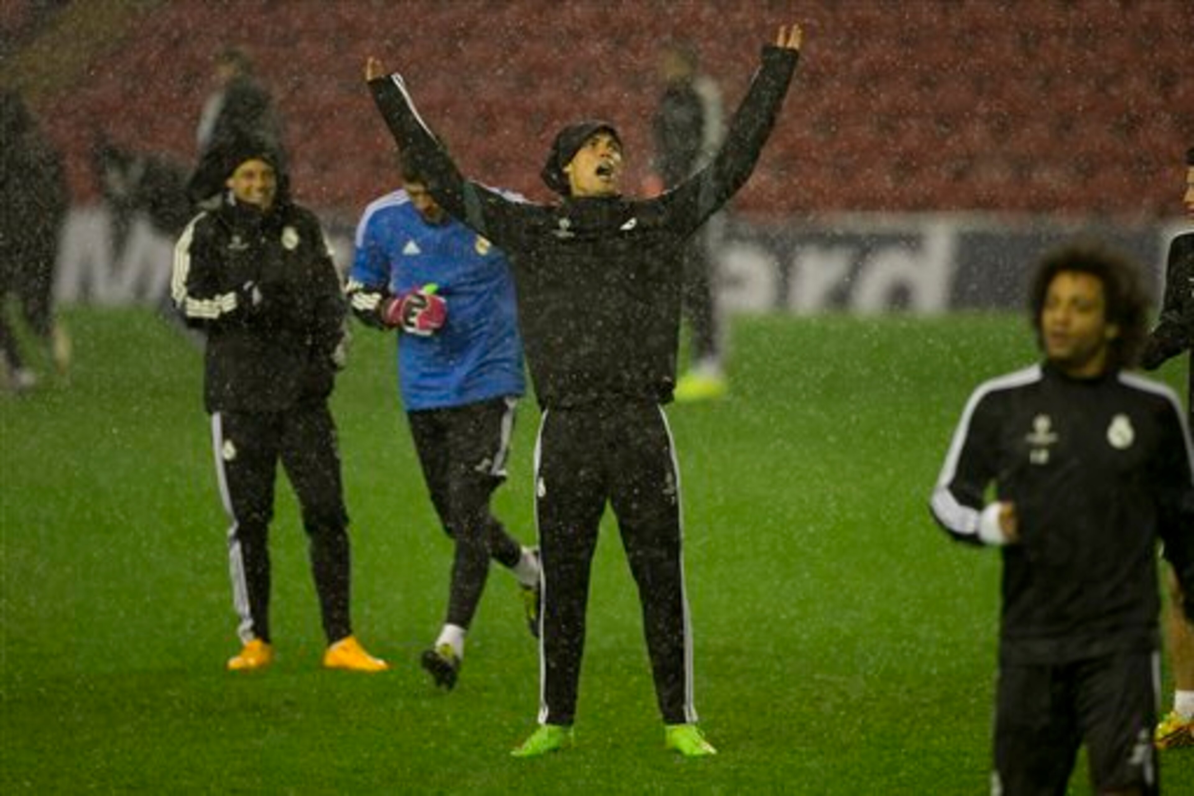 Ronaldo and his team-mates training at Anfield during Hurricane Gonzalo on Tuesday night.