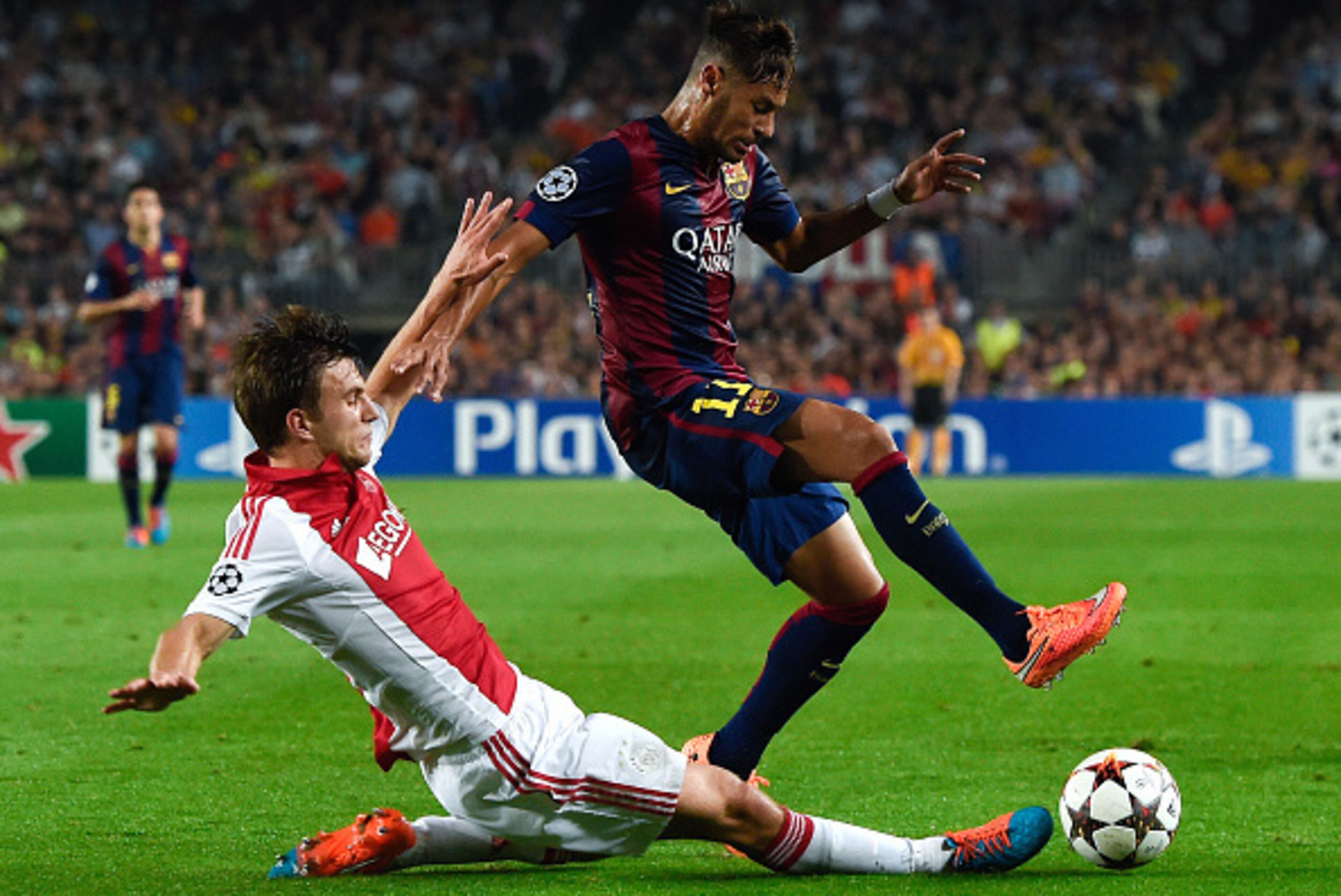 BARCELONA, SPAIN - OCTOBER 21:  Neymar of FC Barcelona competes for the ball with Joel Veltman of AFC Ajax during a UEFA Champions League Group F match between FC Barcelona and AFC Ajax at the Camp Nou Stadium on October 21, 2014 in Barcelona, Spain.  (Ph