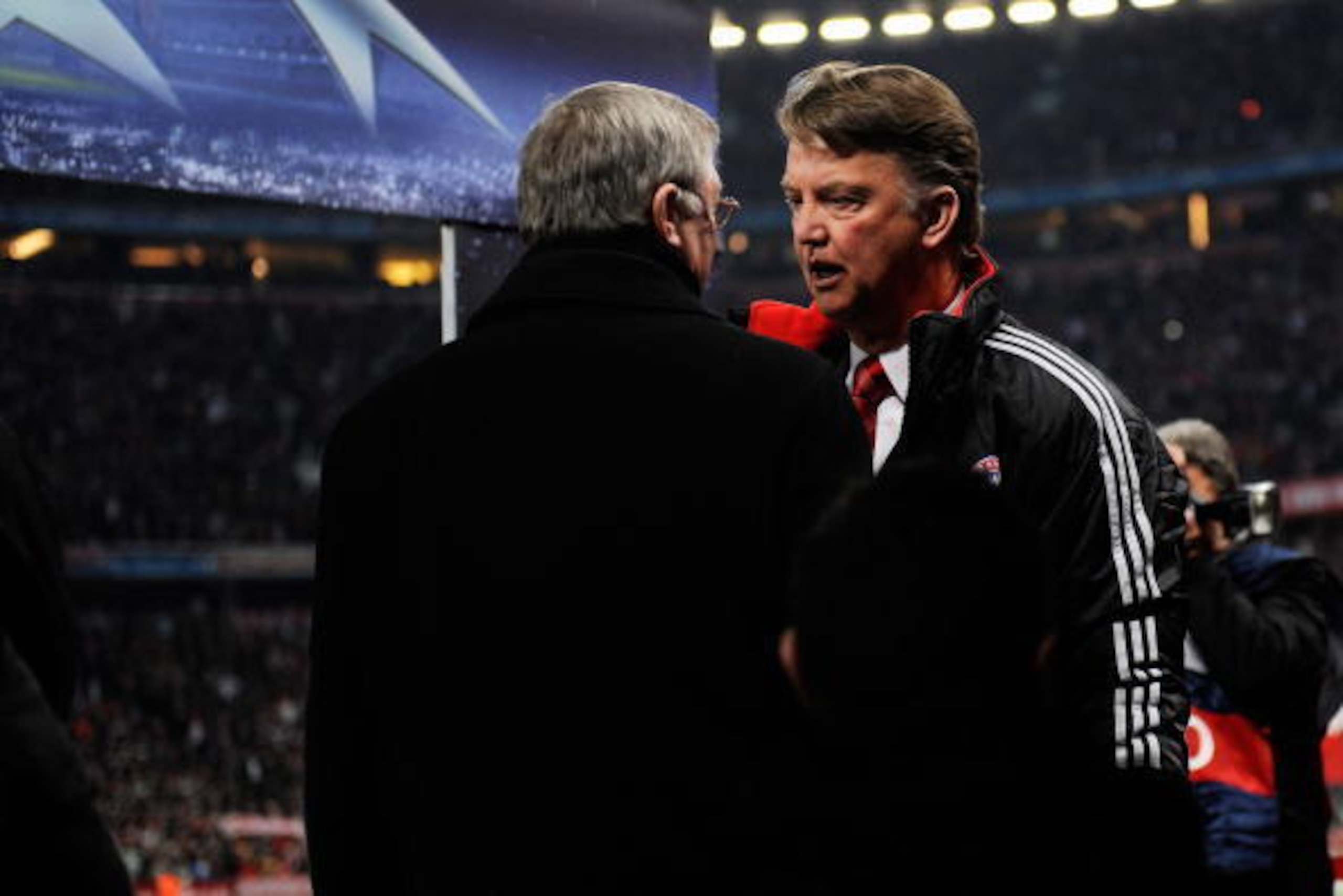 MUNICH, GERMANY - MARCH 30: Louis Van Gaal manager of Bayern Muenchen speaks with Sir Alex Ferguson, manager of Manchester United during the UEFA Champions League quarter final first leg match between Bayern Muenchen and Manchester United at the Allianz A