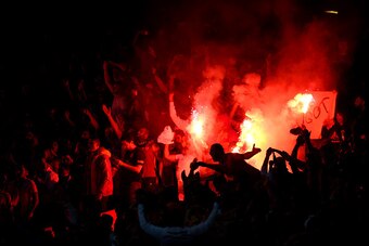 LONDON, ENGLAND - OCTOBER 01:  Galatasaray AS light flare after conceding a second goal during the UEFA Champions League group D match between Arsenal FC and Galatasaray AS at Emirates Stadium on October 1, 2014 in London, United Kingdom.  (Photo by Paul 