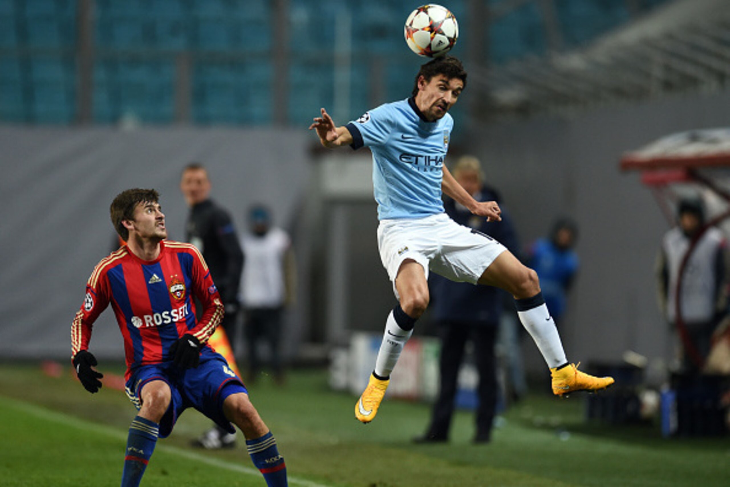 KHIMKI, RUSSIA - OCTOBER 21: Georgi Schennikov (L) of PFC CSKA Moscow challenged by Jesus Navas of Manchester City FC during the UEFA Champions League Group E match between PFC CSKA Moscow and Manchester City FC at the Arena Khimki Stadium on October 21, 