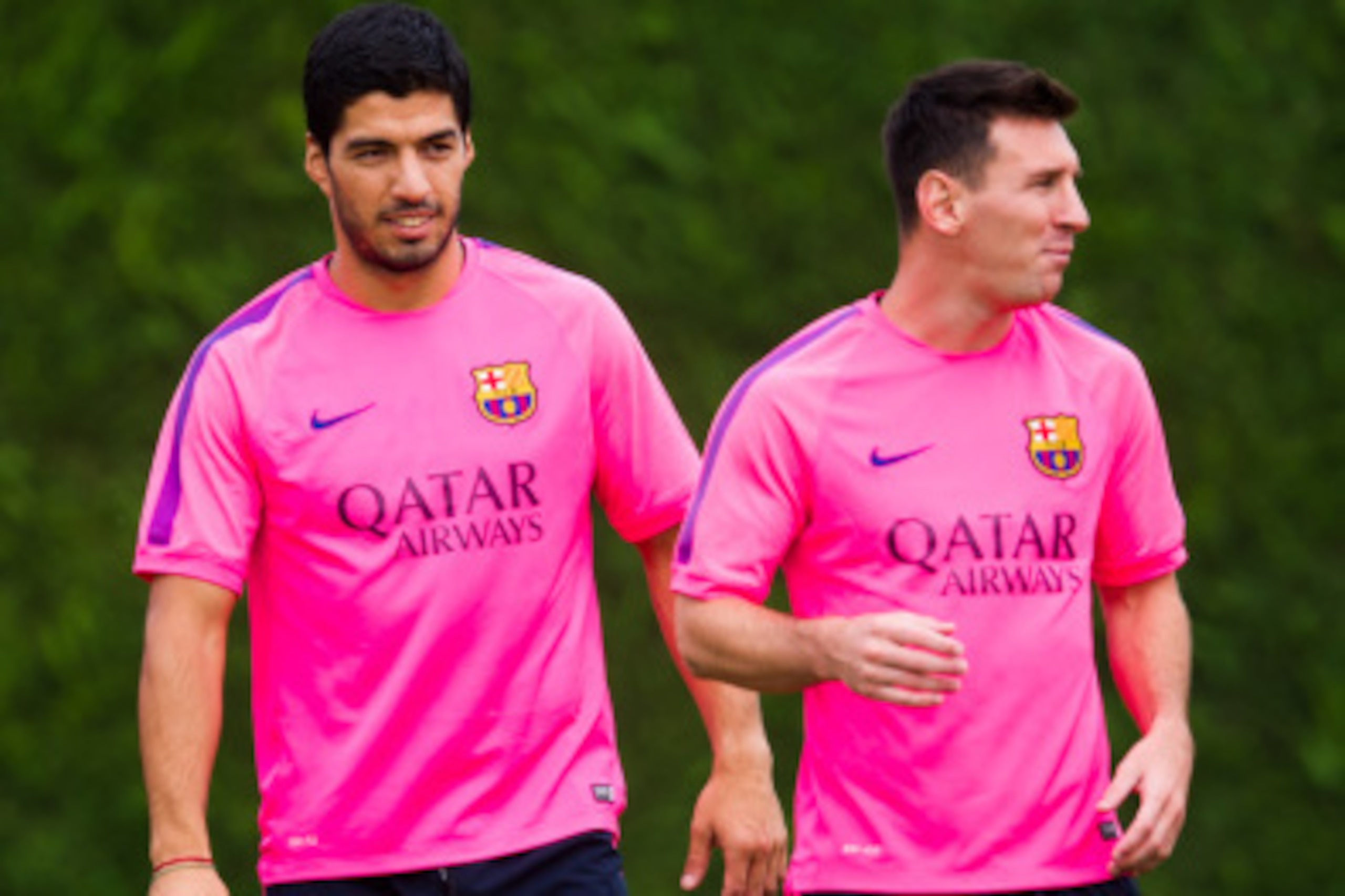 BARCELONA, SPAIN - AUGUST 17: Luis Suarez (L) and Lionel Messi (R) look on during a FC Barcelona training session at Ciutat Esportiva on August 17, 2014 in Barcelona, Spain.  (Photo by Alex Caparros/Getty Images)
