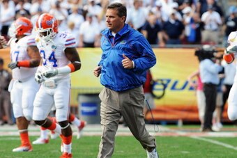 TAMPA, FL - JANUARY 1:  Coach Urban Meyer of the Florida Gators takes the field for play against the Penn State Nittany Lions January 1, 2010 in the 25th Outback Bowl at Raymond James Stadium in Tampa, Florida.  (Photo by Al Messerschmidt/Getty Images)