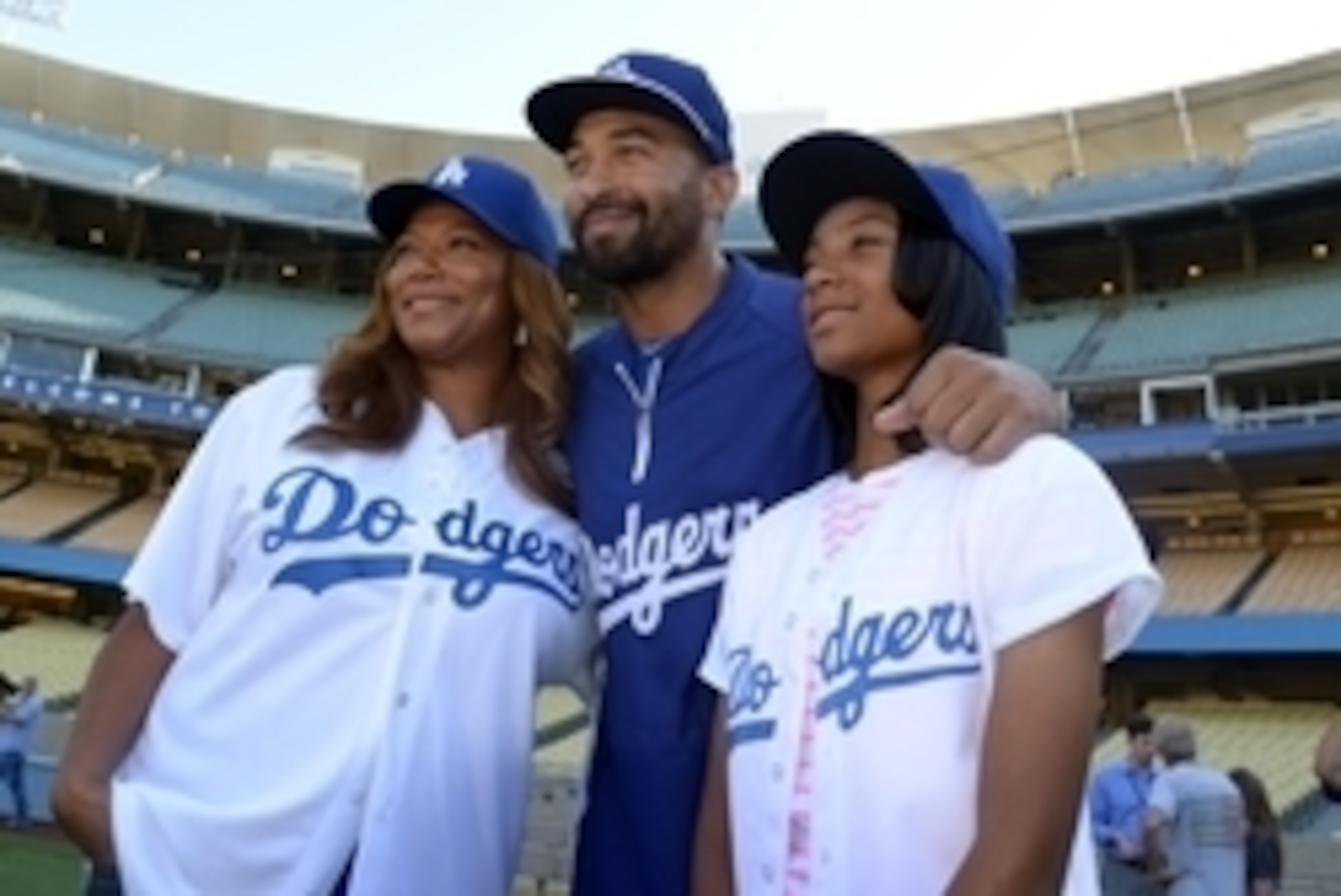 Sep 2, 2014; Los Angeles, CA, USA; Entertainer and actress Queen Latifah (left), Los Angeles Dodgers center fielder Matt Kemp (center) and Taney Dragons little league world series pitcher Mo'Ne Davis pose before the game against the Washington Nationals a