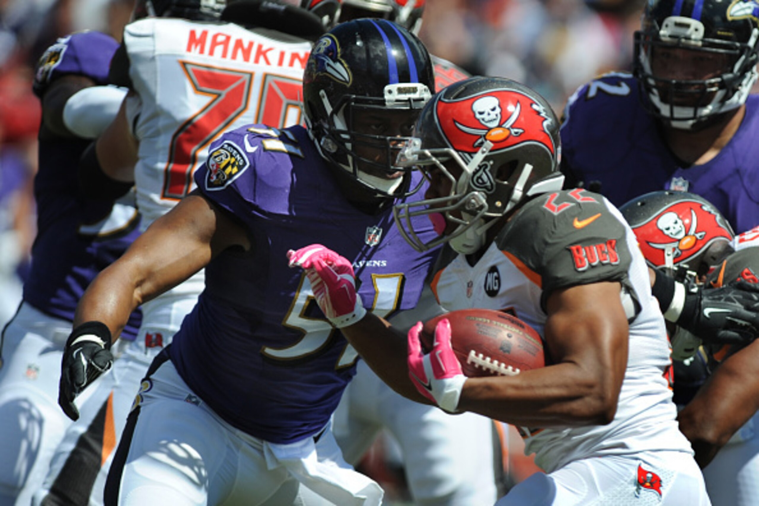 TAMPA, FL - OCTOBER 12: Running back Doug Martin #22 of the Tampa Bay Buccaneers runs into the defense of the Baltimore Ravens at Raymond James Stadium on October 12, 2014 in Tampa, Florida. (Photo by Cliff McBride/Getty Images) TAMPA, FL - OCTOBER 12: Running back Doug Martin #22 of the Tampa Bay Buccaneers runs into the defense of the Baltimore Ravens at Raymond James Stadium on October 12, 2014 in Tampa, Florida. (Photo by Cliff McBride/Getty Images)
