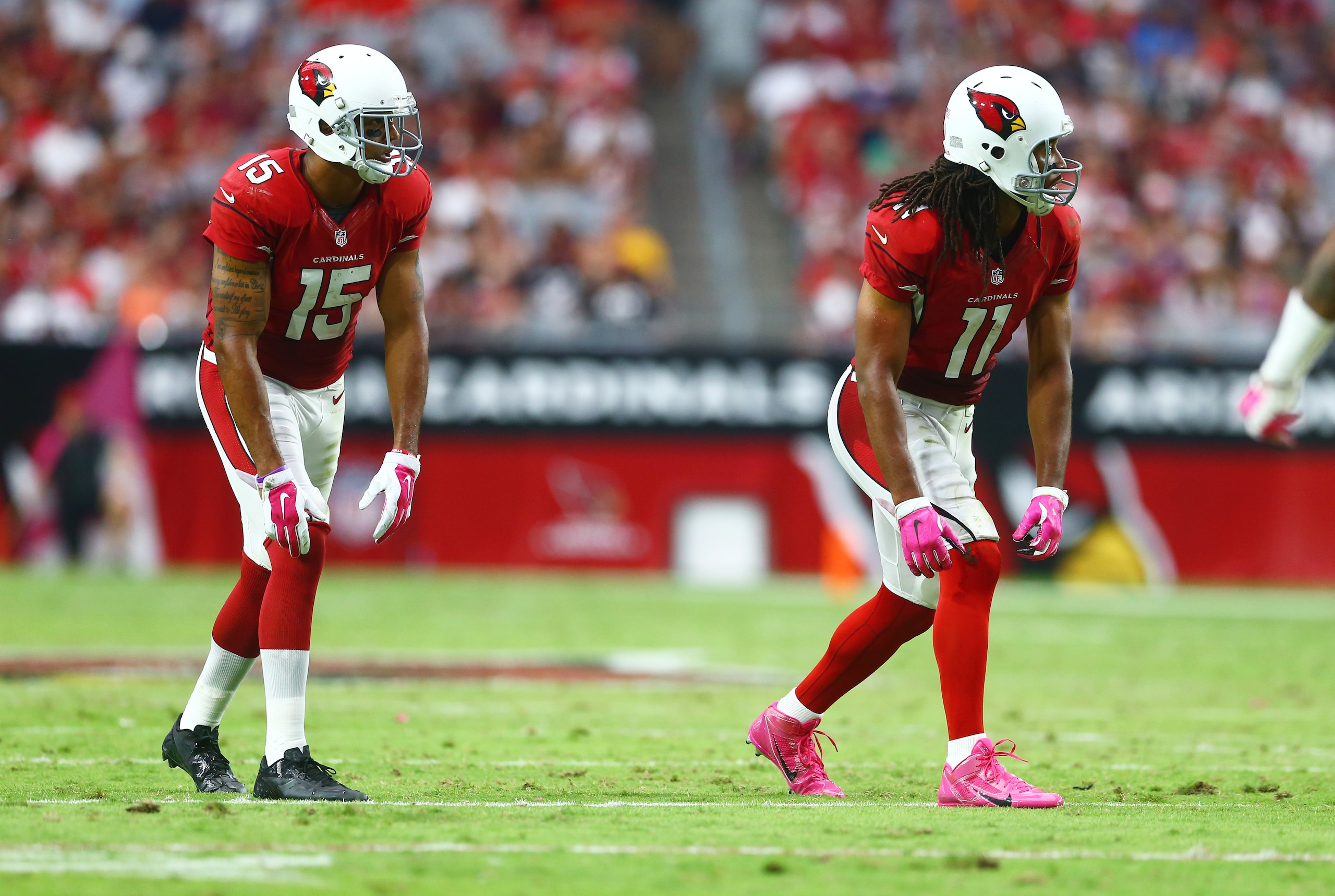 Oct 12, 2014; Glendale, AZ, USA; Arizona Cardinals wide receiver Michael Floyd (15) and wide receiver Larry Fitzgerald (11) against the Washington Redskins at University of Phoenix Stadium. Mandatory Credit: Mark J. Rebilas-USA TODAY Sports Oct 12, 2014; Glendale, AZ, USA; Arizona Cardinals wide receiver Michael Floyd (15) and wide receiver Larry Fitzgerald (11) against the Washington Redskins at University of Phoenix Stadium. Mandatory Credit: Mark J. Rebilas-USA TODAY Sports