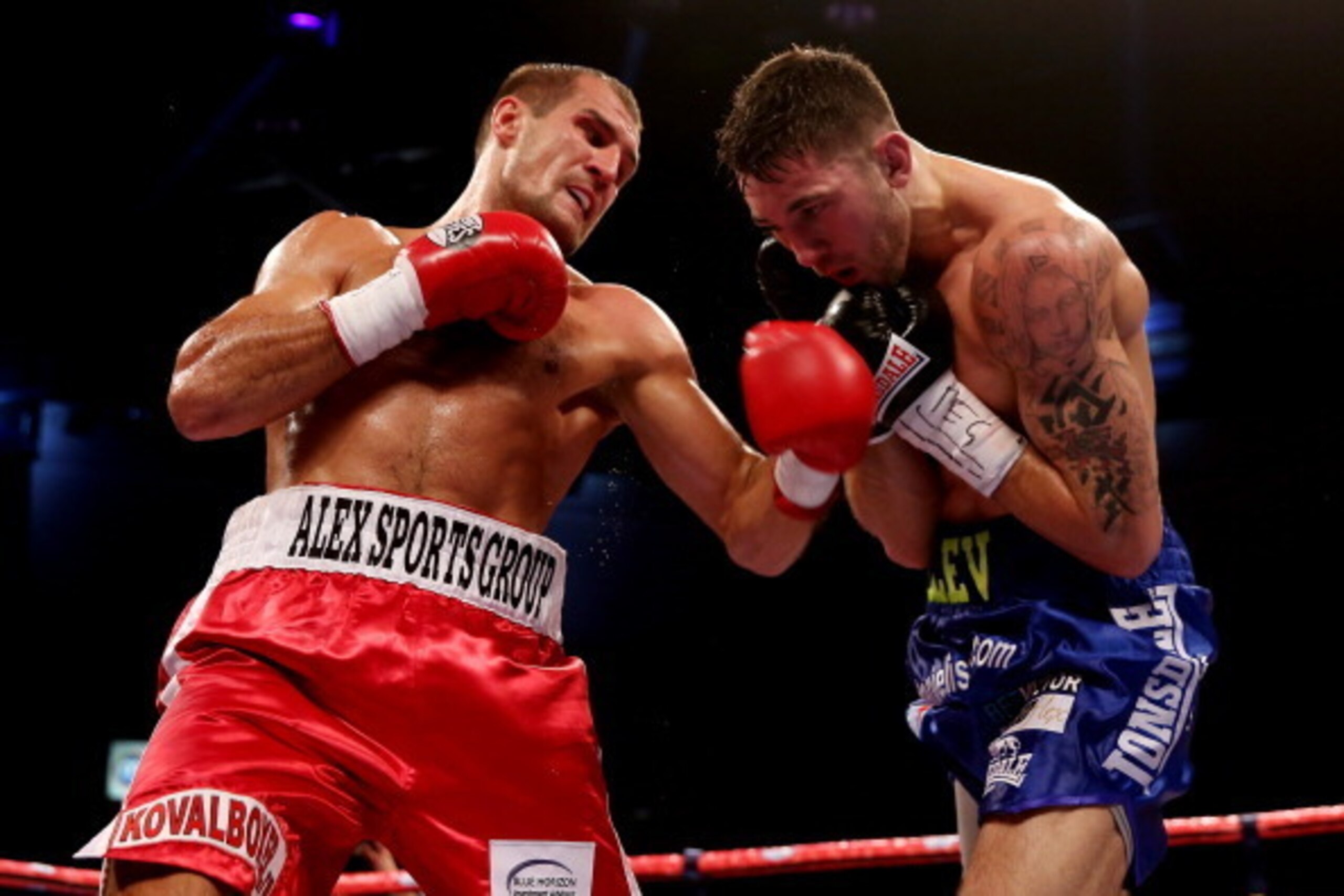 CARDIFF, WALES - AUGUST 17:  Nathan Cleverly (R) in action against Sergey Kovalev during the WBO World Light-Heavyweight Championship bout at Motorpoint Arena on August 17, 2013 in Cardiff, Wales.  (Photo by Scott Heavey/Getty Images)