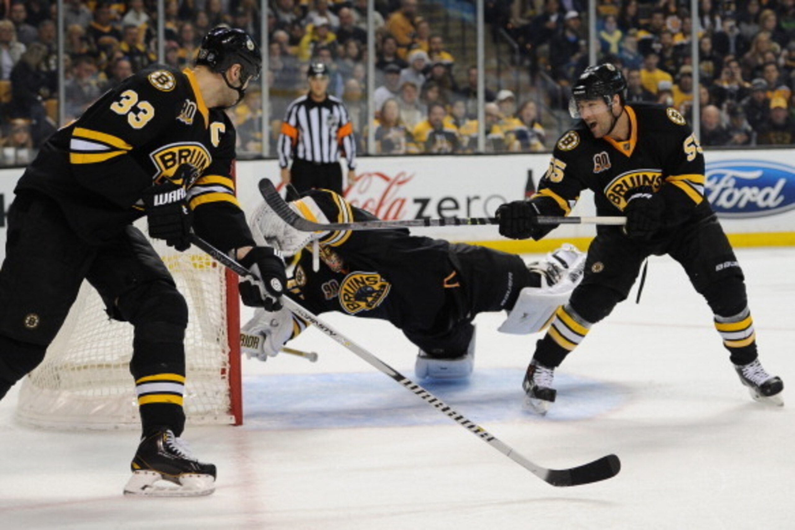 BOSTON, MA - APRIL 5: Zdeno Chara #33, Tuukka Rask #40 and Johnny Boychuk #55 of the Boston Bruins try to stop the puck against the Philadelphia Flyers at the TD Garden on April 5, 2014 in Boston, Massachusetts. (Photo by Brian Babineau/NHLI via Getty Ima