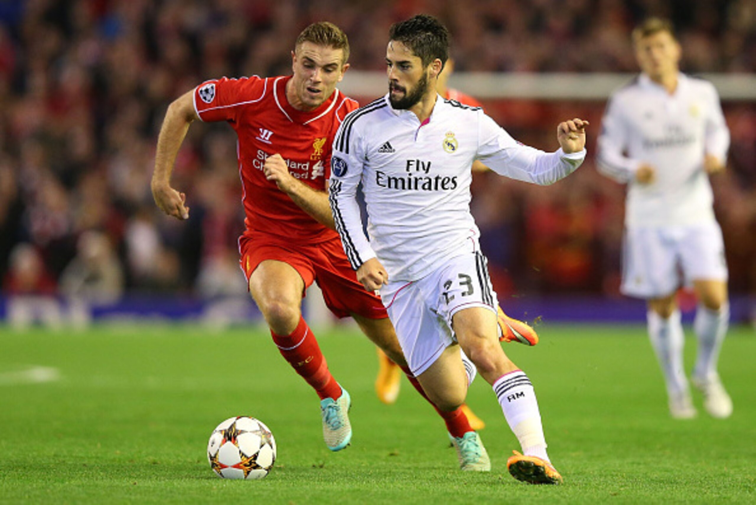 LIVERPOOL, ENGLAND - OCTOBER 22:  Isco of Real Madrid competes with Jordan Henderson of Liverpool during the UEFA Champions League Group B match between Liverpool and Real Madrid CF on October 22, 2014 in Liverpool, United Kingdom.  (Photo by Alex Livesey
