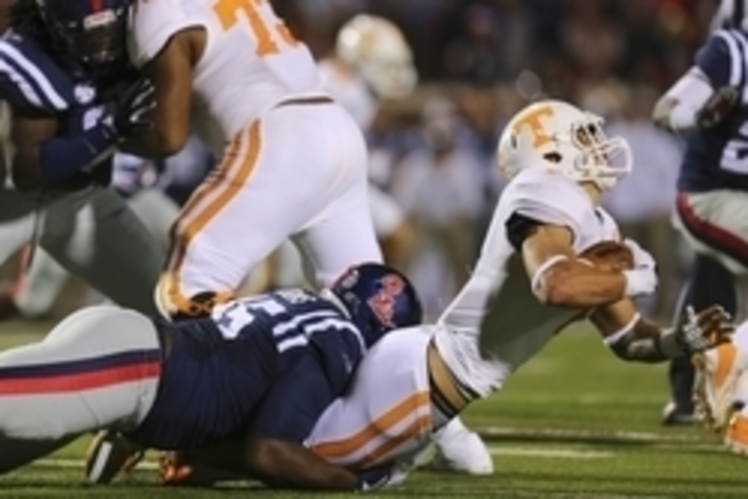 Oct 18, 2014; Oxford, MS, USA; Mississippi Rebels defensive tackle Lavon Hooks (45) tackles Tennessee Volunteers running back Jalen Hurd (1) during the game at Vaught-Hemingway Stadium. The Mississippi Rebels defeated the Tennessee Volunteers 34-3.  Manda