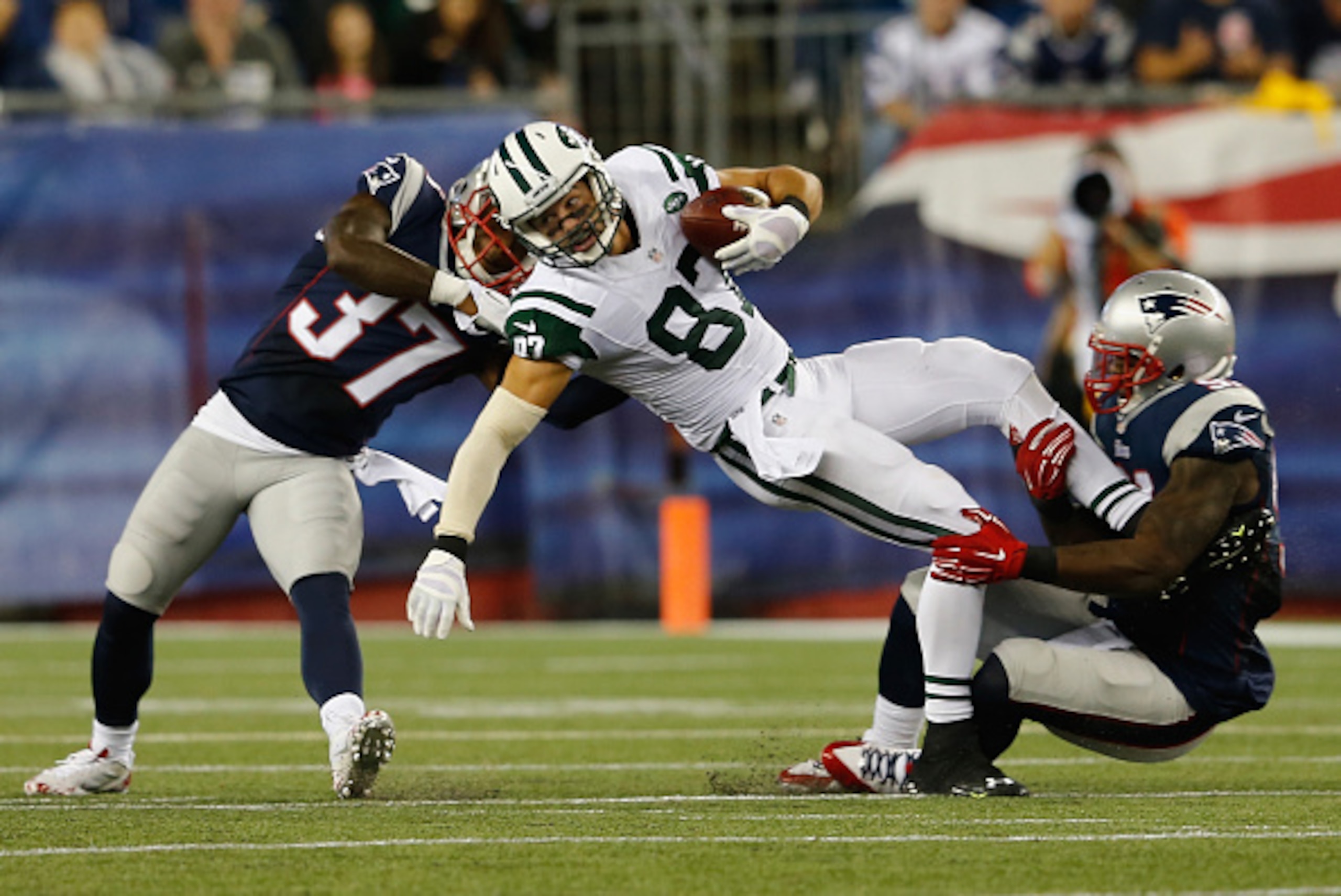 FOXBORO, MA - OCTOBER 16: Eric Decker #87 of the New York Jets is tackled during the third quarter against the New England Patriots at Gillette Stadium on October 16, 2014 in Foxboro, Massachusetts. (Photo by Jim Rogash/Getty Images) FOXBORO, MA - OCTOBER 16: Eric Decker #87 of the New York Jets is tackled during the third quarter against the New England Patriots at Gillette Stadium on October 16, 2014 in Foxboro, Massachusetts. (Photo by Jim Rogash/Getty Images)