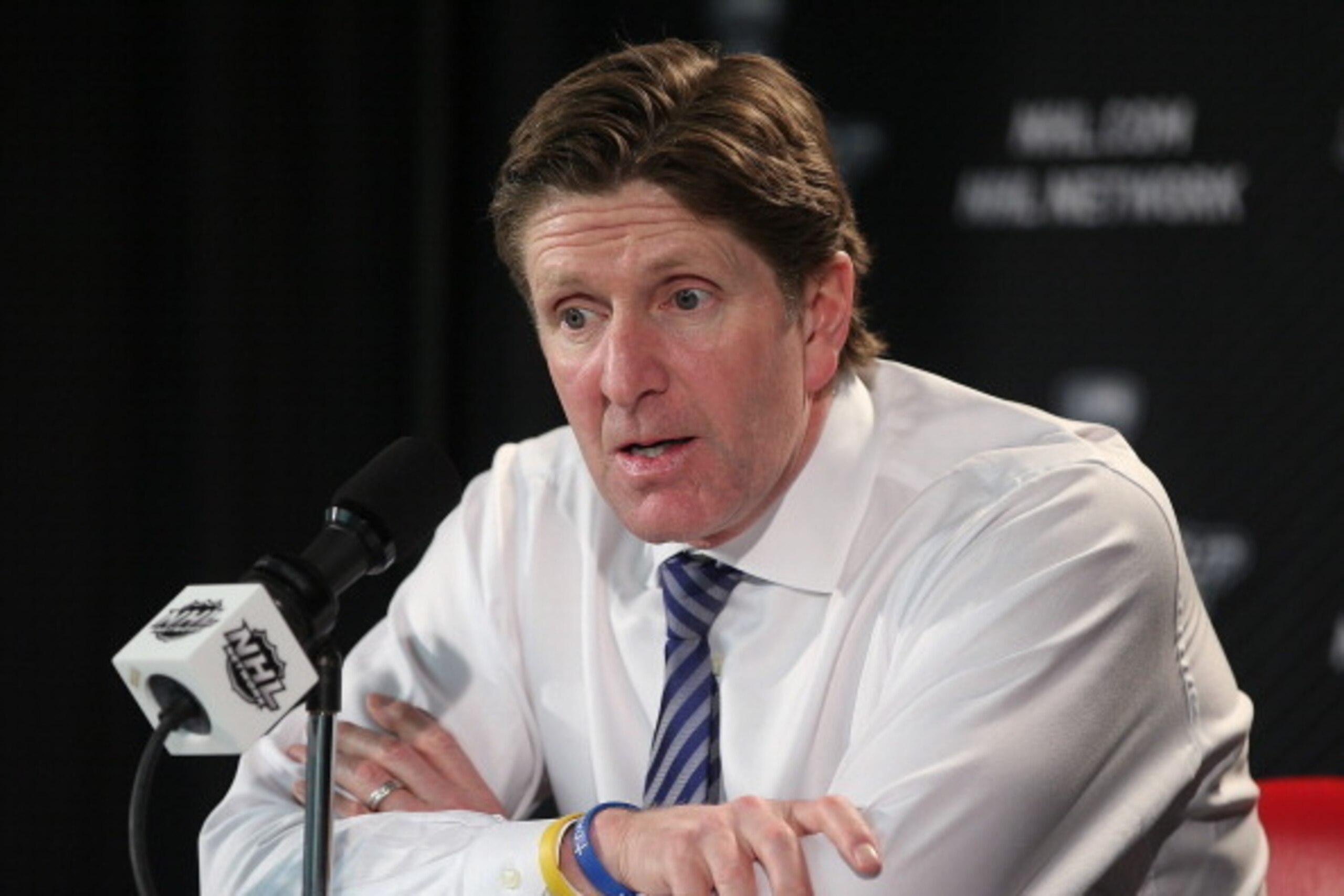 DETROIT, MI - APRIL 24:  Mike Babcock of the Detroit Red Wings addresses the media after Game Four of the First Round of the 2014 Stanley Cup Playoffs against the Boston Bruins on April 24, 2014 at Joe Louis Arena in Detroit, Michigan. Bruins defeated Det