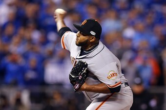 KANSAS CITY, MO - OCTOBER 22:  Jean Machi #63 of the San Francisco Giants pitches against the Kansas City Royals during Game Two of the 2014 World Series at Kauffman Stadium on October 22, 2014 in Kansas City, Missouri.  (Photo by Elsa/Getty Images)