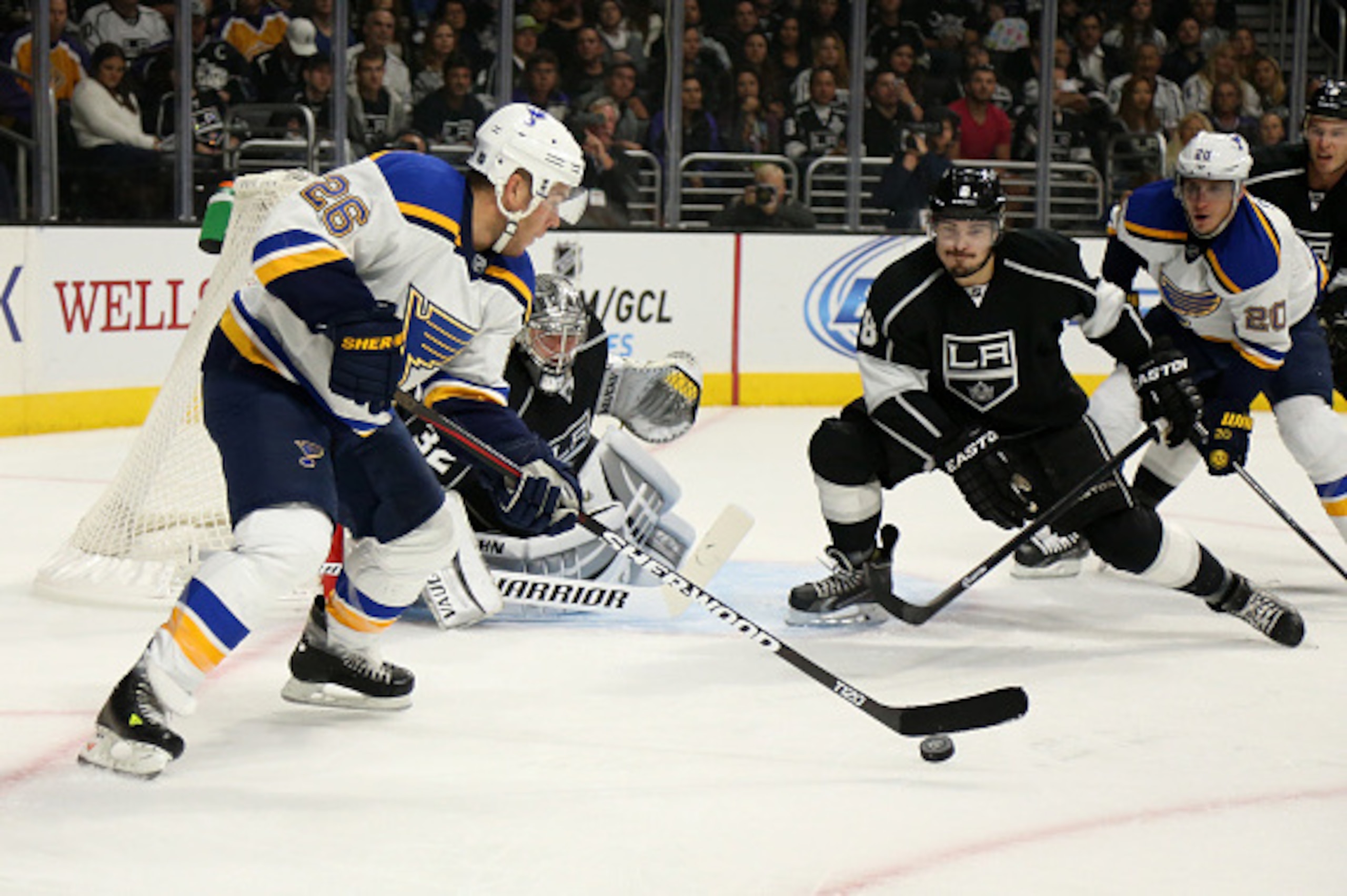LOS ANGELES, CA - OCTOBER 16:  Paul Stastny #26 of the St. Louis Blues tries to get off a shot against Drew Doughty #8 and goalie Joanthan Quick #32 of the Los Angeles Kings at Staples Center on October 16, 2014 in Los Angeles, California.  (Photo by Step