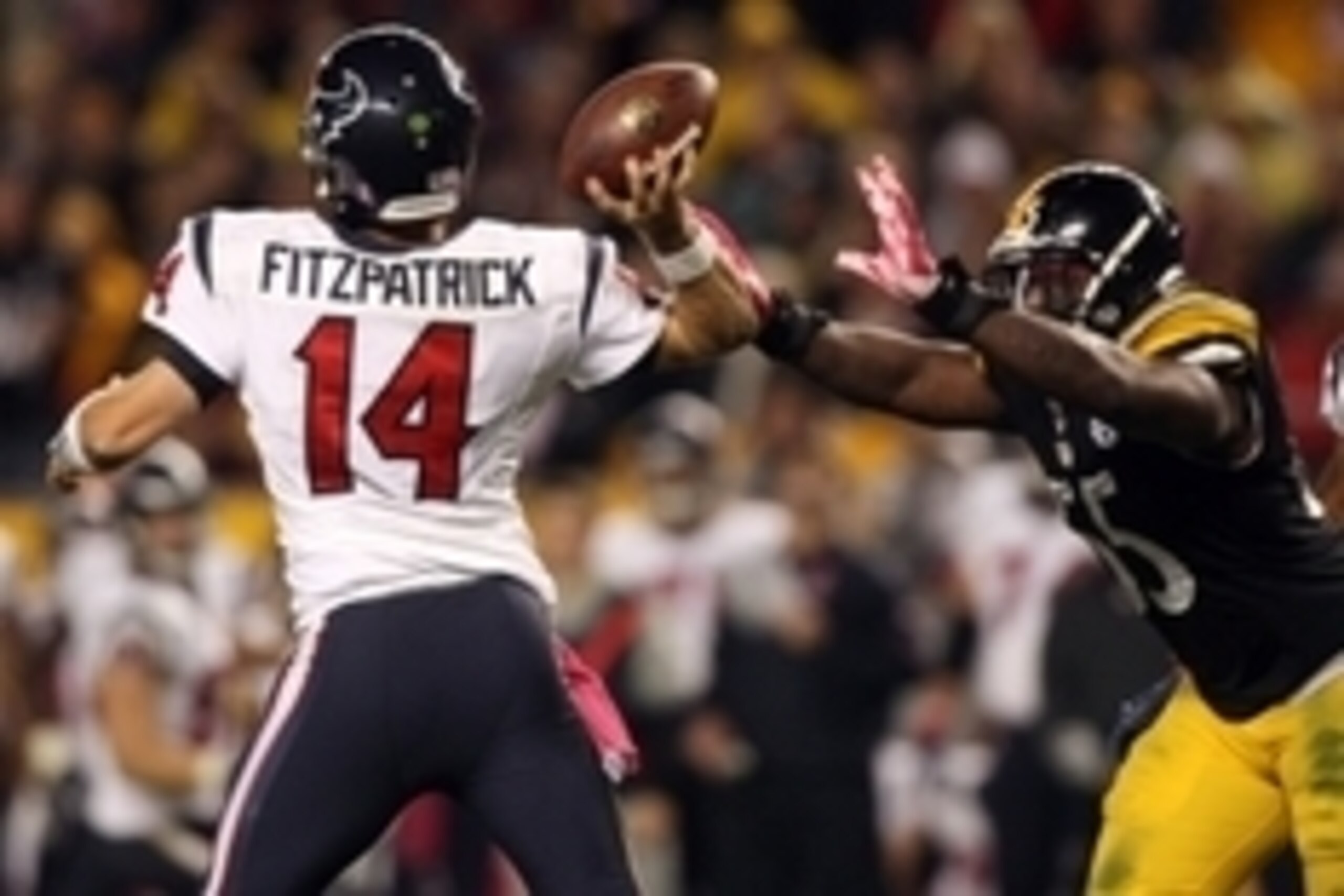 Oct 20, 2014; Pittsburgh, PA, USA; Pittsburgh Steelers linebacker Arthur Moats (55) pressures Houston Texans quarterback Ryan Fitzpatrick (14) during the second half at Heinz Field. The Steelers won the game, 30-23. Mandatory Credit: Jason Bridge-USA TODA