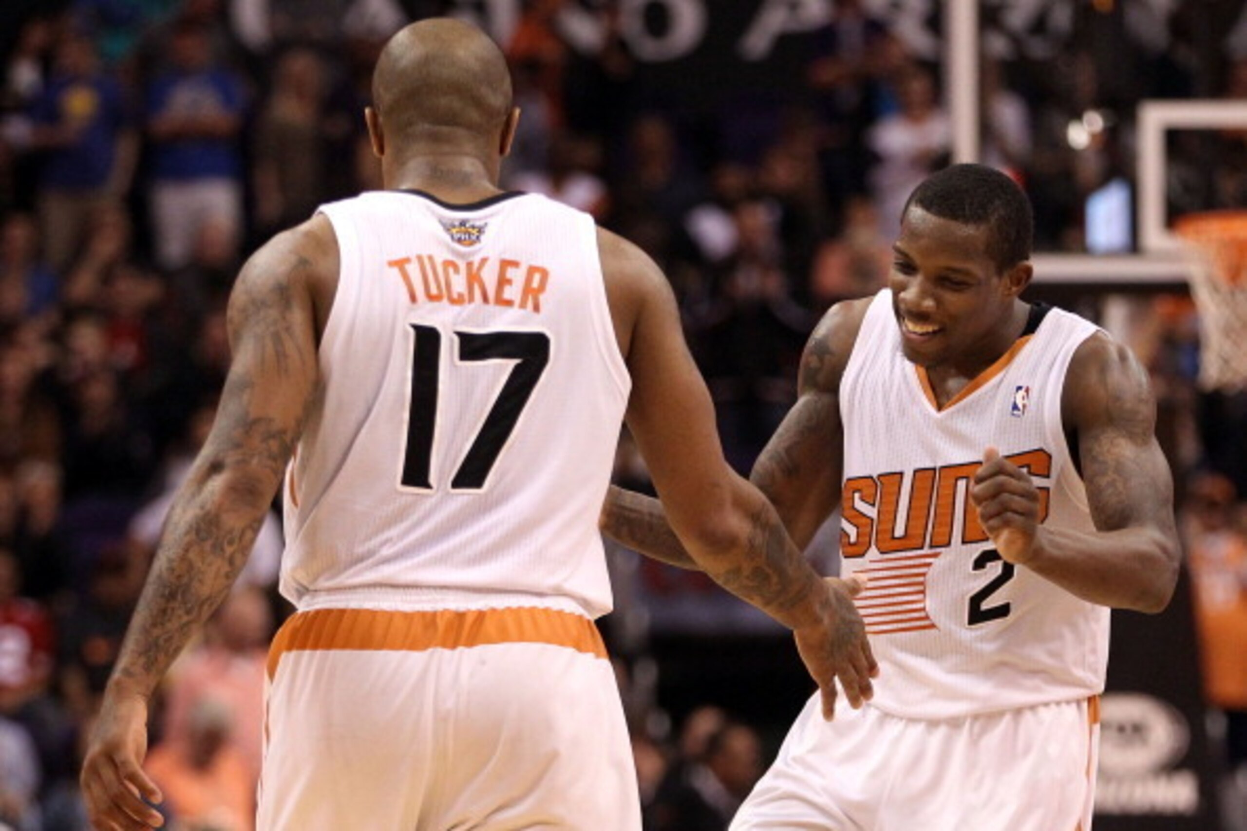 PHOENIX, AZ - DECEMBER 15:  Eric Bledsoe #2 of the Phoenix Suns celebrates with P.J. Tucker #17 after scoring against the Golden State Warriors late in the fourth quarterof the NBA game at US Airways Center on December 15, 2013 in Phoenix, Arizona. The Su