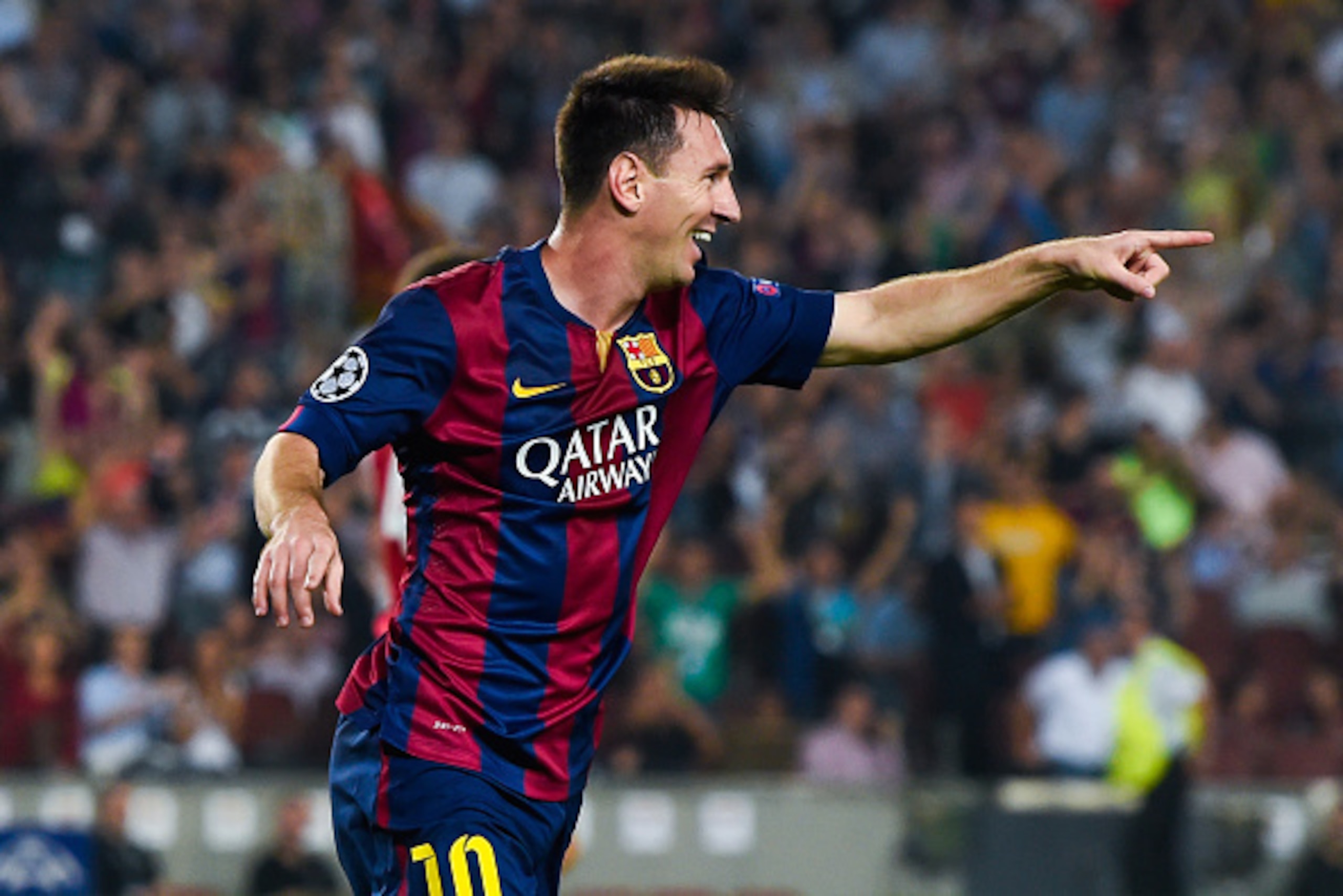 BARCELONA, SPAIN - OCTOBER 21:  Lionel Messi of FC Barcelona celebrates after scoring his team's second goal during a UEFA Champions League Group F match between FC Barcelona and AFC Ajax at the Camp Nou Stadium on October 21, 2014 in Barcelona, Spain.  (
