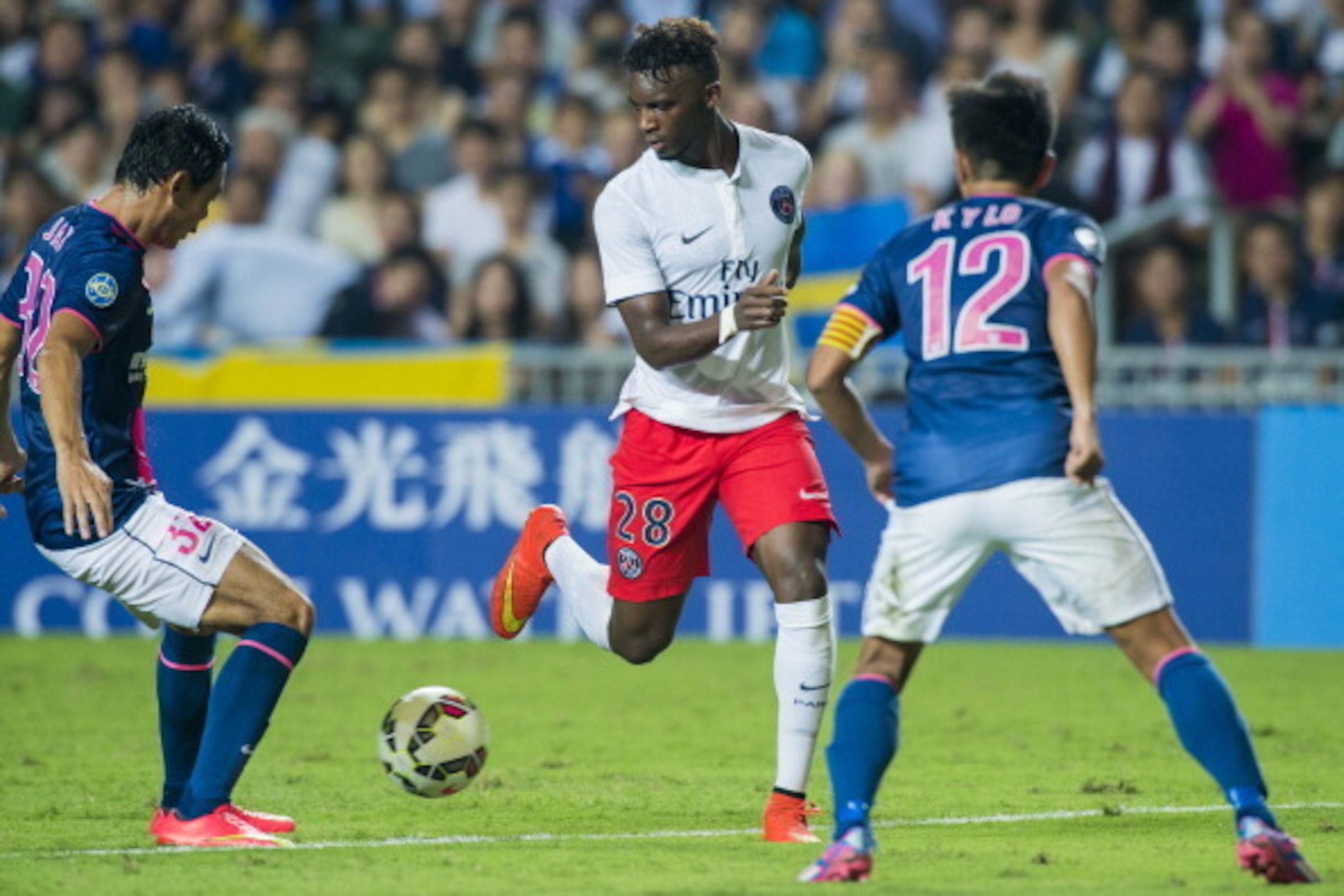 HONG KONG - JULY 29:  Jean-Christophe Bahebeck (C) of Paris Saint-Germain in action during the friendly match between Kitchee and Paris Saint-Germain at Hong Kong Stadium on July 29, 2014 in Hong Kong, Hong Kong.  (Photo by Victor Fraile/Getty Images)