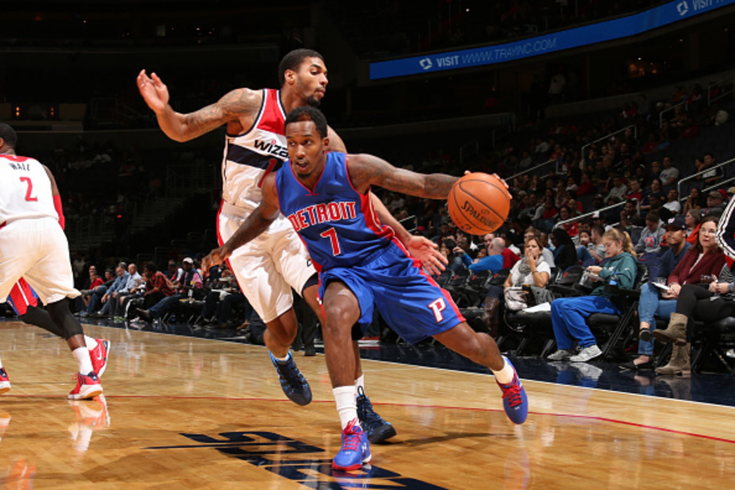 WASHINGTON, DC - OCTOBER 12: Brandon Jennings #7 of the Detroit Pistons drives against Glen Rice #14 of the Washington Wizards during a preseason game at the Verizon Center on October 12, 2014 in Washington, DC. NOTE TO USER: User expressly acknowledges a