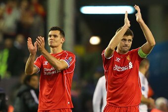 LIVERPOOL, ENGLAND - OCTOBER 22:  Steven Gerrard of Liverpool and Dejan Lovren (L) acknowledge the fans at the end of the UEFA Champions League Group B match between Liverpool and Real Madrid CF on October 22, 2014 in Liverpool, United Kingdom.  (Photo by