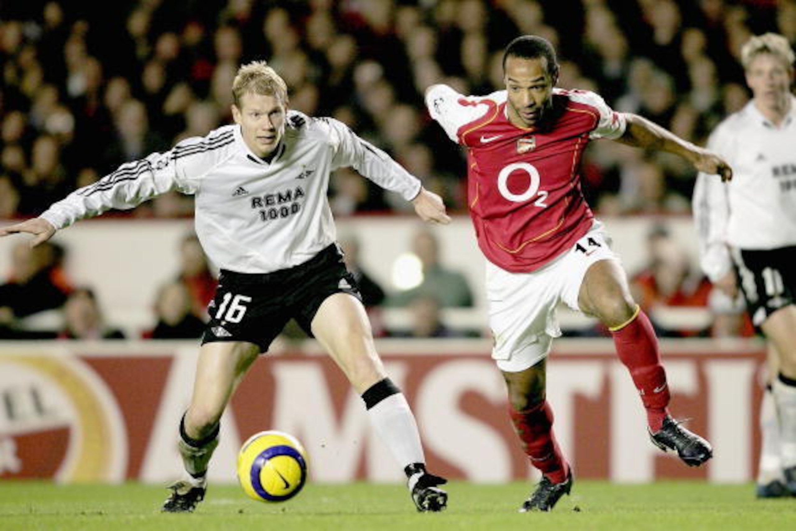 LONDON - DECEMBER 7:  Thierry Henry of Arsenal is challanged by Per Ciljan Skjelbred of Rosenborg during the Champions League Group E match between Arsenal and Rosenborg at Highbury on December 7, 2004 in London, England.  (Photo by Shaun Botterill/Getty 