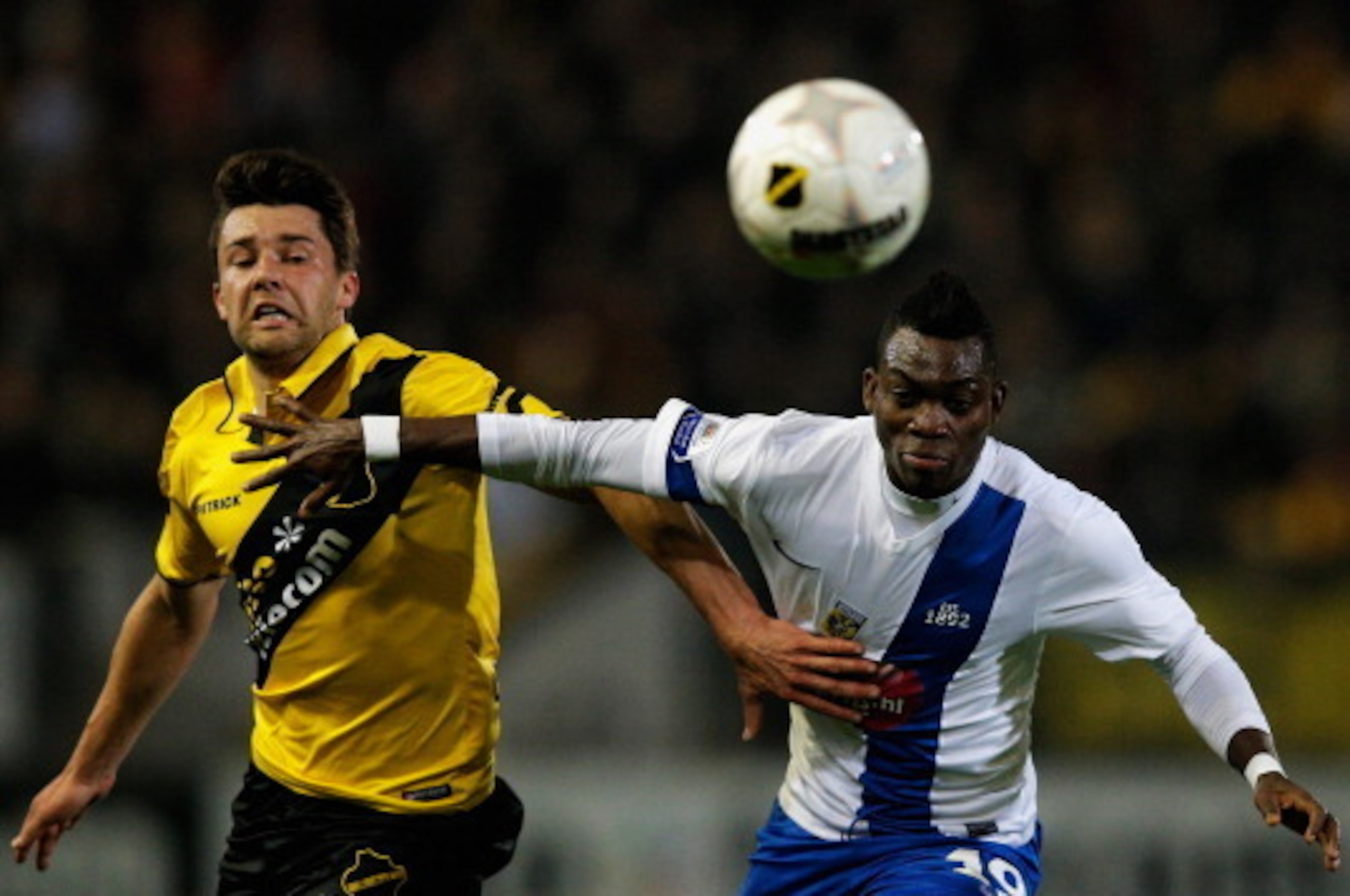 BREDA, NETHERLANDS - MARCH 08: Sepp De Roover (L) of NAC and Christian Atsu of Vitesse battle for the ball during the Eredivisie match between NAC Breda and Vitesse at the Rat Verlegh Stadion on March 8, 2014 in Breda, Netherlands. (Photo by Dean Mouhta BREDA, NETHERLANDS - MARCH 08: Sepp De Roover (L) of NAC and Christian Atsu of Vitesse battle for the ball during the Eredivisie match between NAC Breda and Vitesse at the Rat Verlegh Stadion on March 8, 2014 in Breda, Netherlands. (Photo by Dean Mouhta
