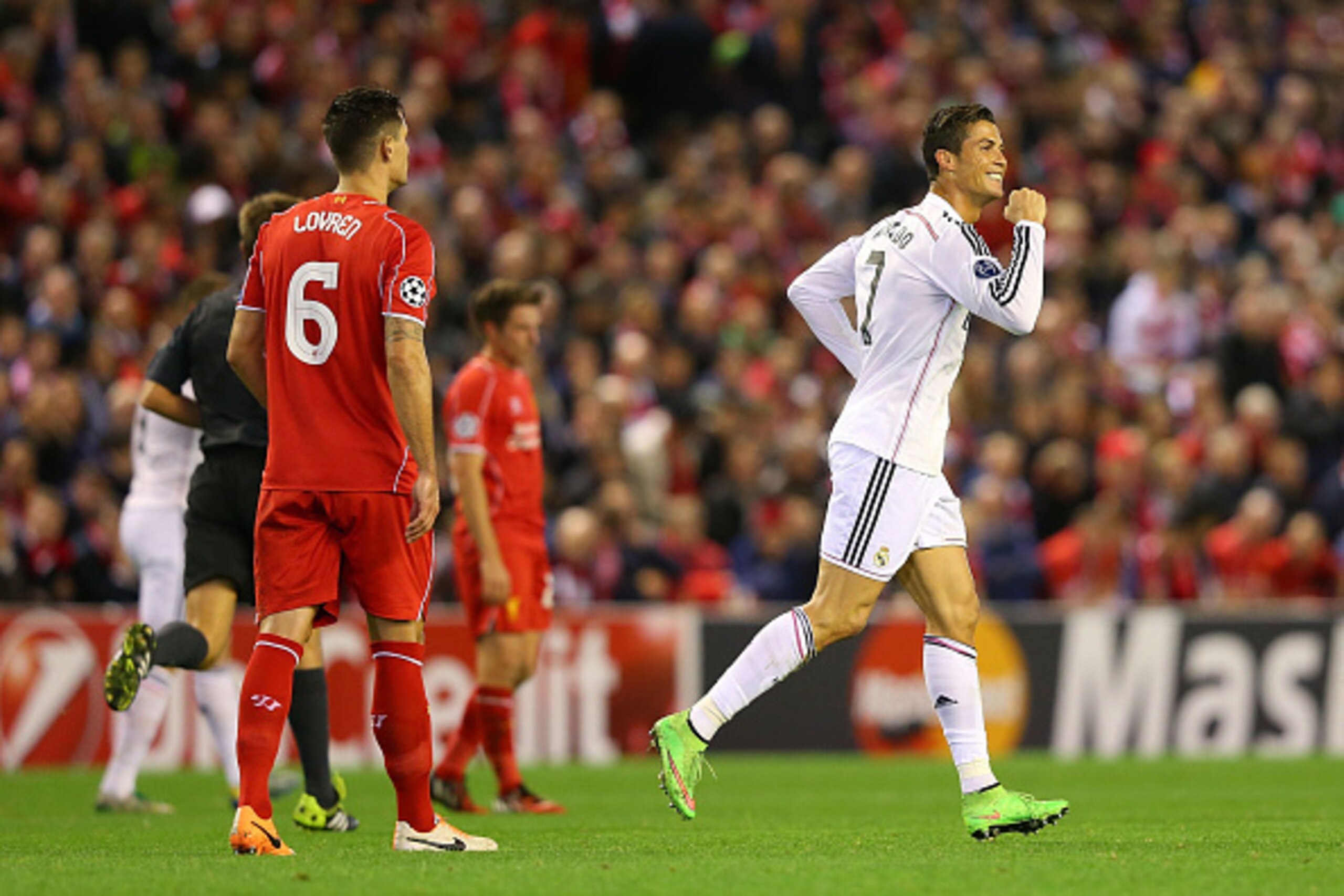 LIVERPOOL, ENGLAND - OCTOBER 22:  Cristiano Ronaldo of Real Madrid celebrates scoring the opening goal during the UEFA Champions League Group B match between Liverpool and Real Madrid CF on October 22, 2014 in Liverpool, United Kingdom.  (Photo by Alex Li