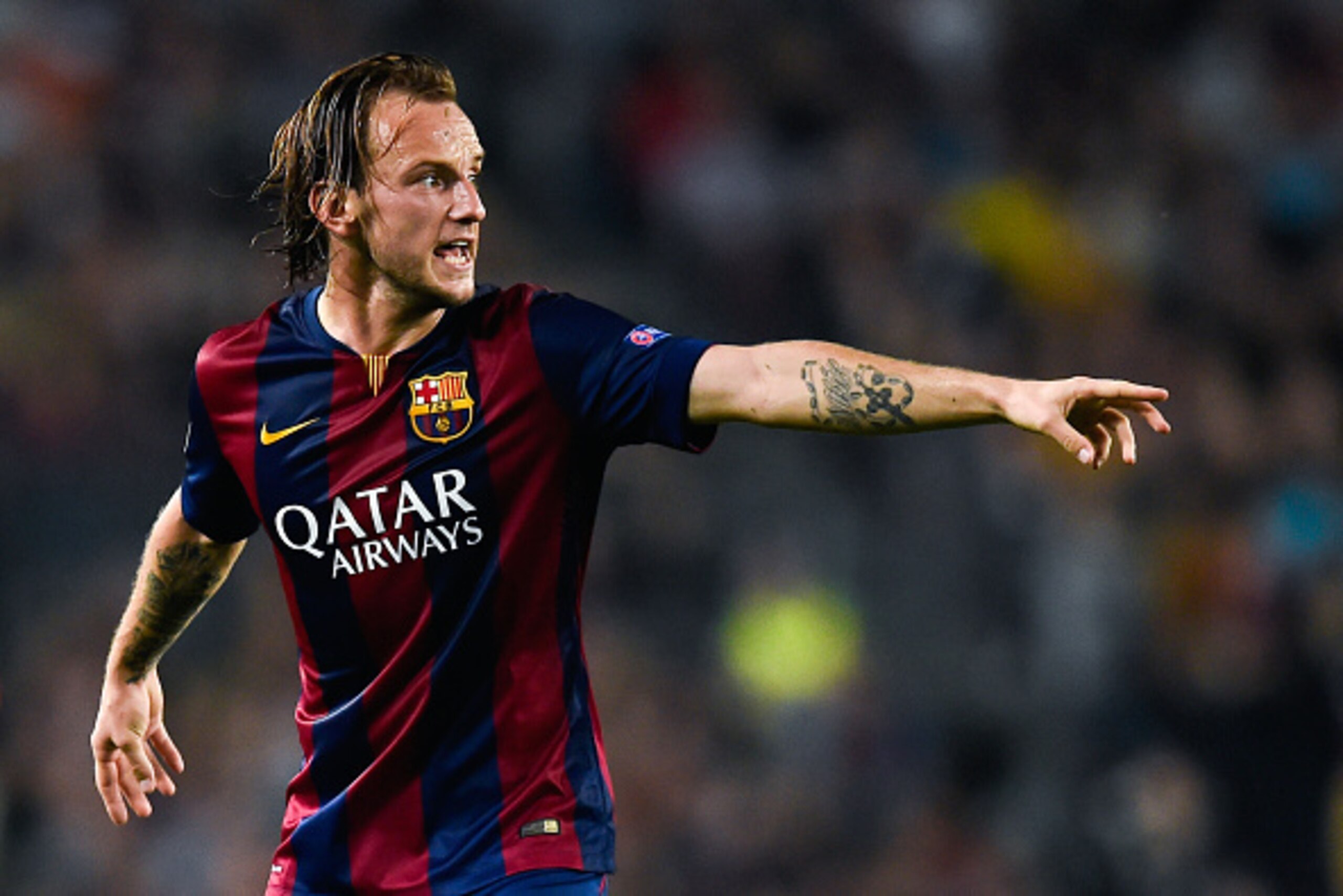 BARCELONA, SPAIN - OCTOBER 21:  Ivan Rakitic of FC Barcelona reacts during a UEFA Champions League Group F match between FC Barcelona and AFC Ajax at the Camp Nou Stadium on October 21, 2014 in Barcelona, Spain.  (Photo by David Ramos/Getty Images)