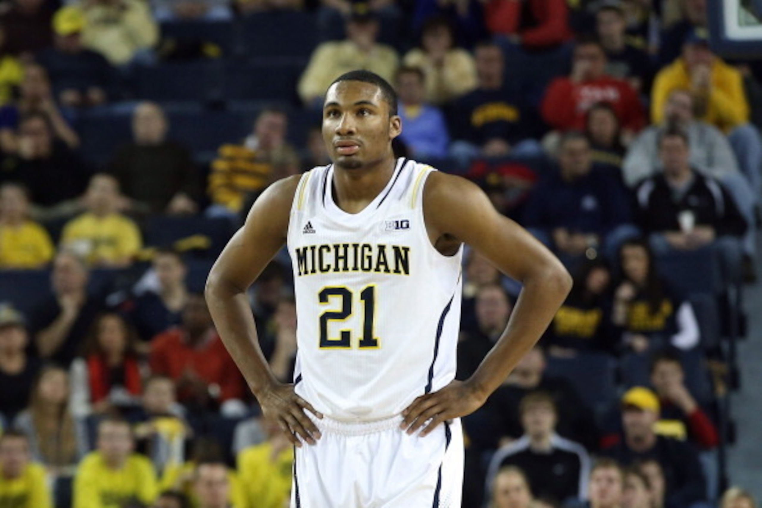ANN ARBOR, MI - NOVEMBER 29: Zak Irvin #21 of the Michigan Wolverines looks to the bench during the second half of the game against Coppin State Eagles at Crisler Center on November 29, 2013 in Ann Arbor, Michigan.  (Photo by Leon Halip/Getty Images)