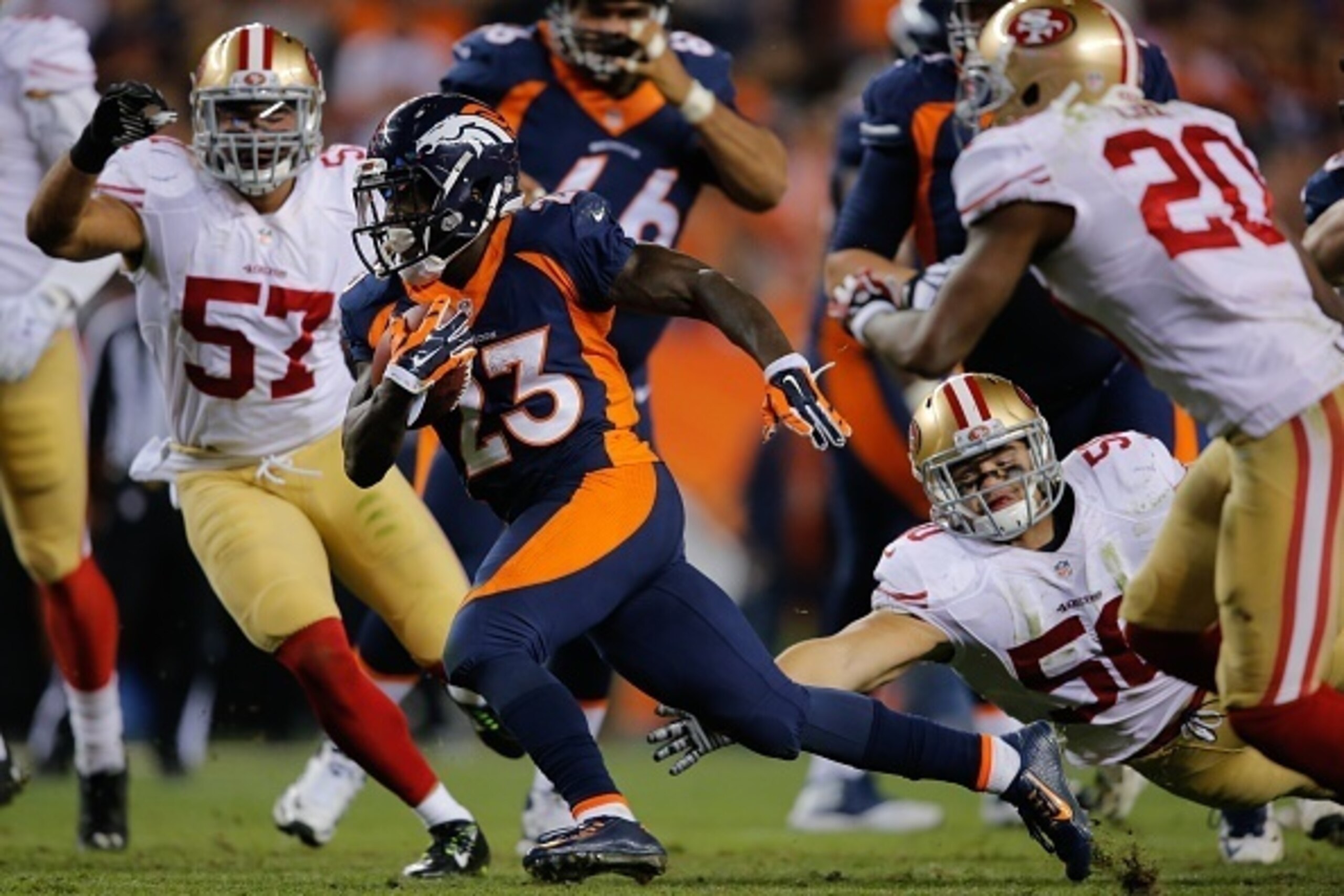 DENVER, CO - OCTOBER 19:  Running back Ronnie Hillman #23 of the Denver Broncos rushes for a 37 yard 3rd quarter touchdown against the San Francisco 49ers at Sports Authority Field at Mile High on October 19, 2014 in Denver, Colorado.  (Photo by Doug Pens