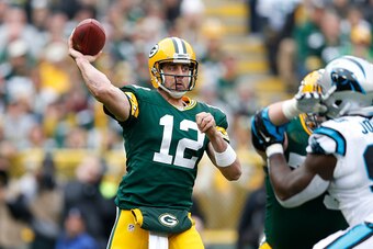 GREEN BAY, WI - OCTOBER 19:  Aaron Rodgers #12 of the Green Bay Packers passes the ball in the first half of the game against the Carolina Panthers at Lambeau Field on October 19, 2014 in Green Bay, Wisconsin. (Photo by Joe Robbins/Getty Images)