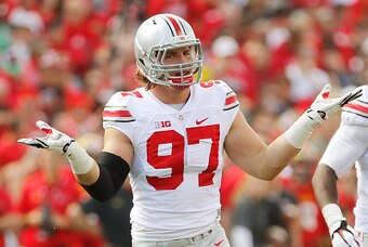 COLLEGE PARK, MD - OCTOBER 04:  Defensive end Joey Bosa #97 of the Ohio State Buckeyes celebrates after one of his first-half sacks against the Maryland Terrapins at Byrd Stadium on October 4, 2014 in College Park, Maryland. Also pictured is teammate Stev