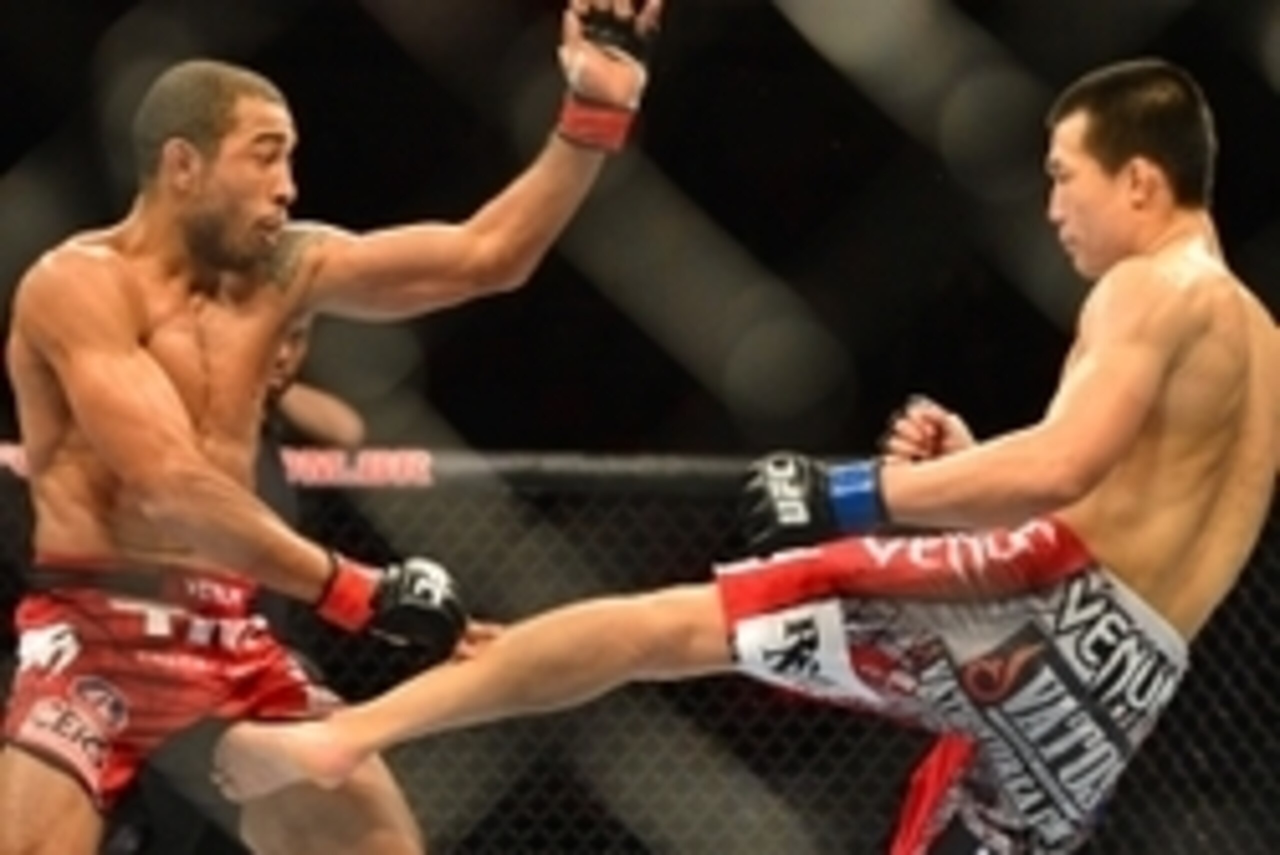 Aug 3, 2013; Rio De Janeiro, Brazil; Jose Aldo (red gloves) fights Chan Sung Jung (blue gloves) during UFC 163 at HSBC Arena. Mandatory Credit: Jason Silva-USA TODAY Sports