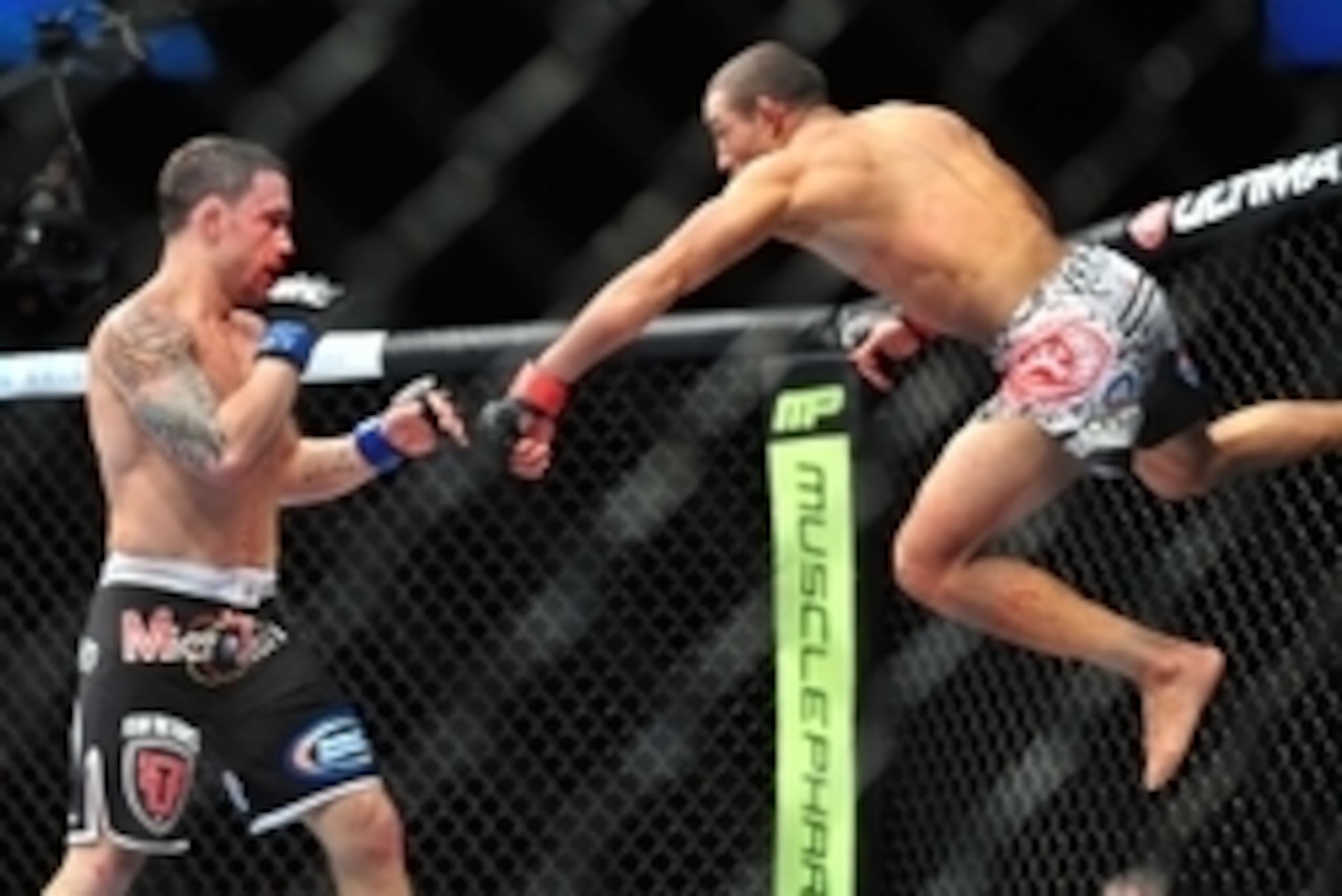 Feb 2, 2013; Las Vegas, NV, USA; Frankie Edgar (left) and Jose Aldo (right) battle each other during UFC 156 at the Mandalay Bay Events Center. Mandatory Credit: Gary A. Vasquez-USA TODAY Sports