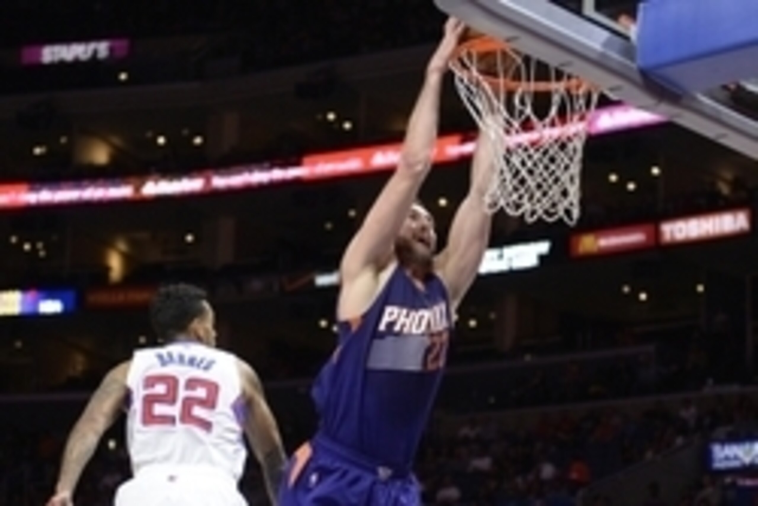 Oct 22, 2014; Los Angeles, CA, USA; Phoenix Suns center Miles Plumlee (22) shoots against Los Angeles Clippers forward Matt Barnes (22) during the game at Staples Center. Mandatory Credit: Richard Mackson-USA TODAY Sports