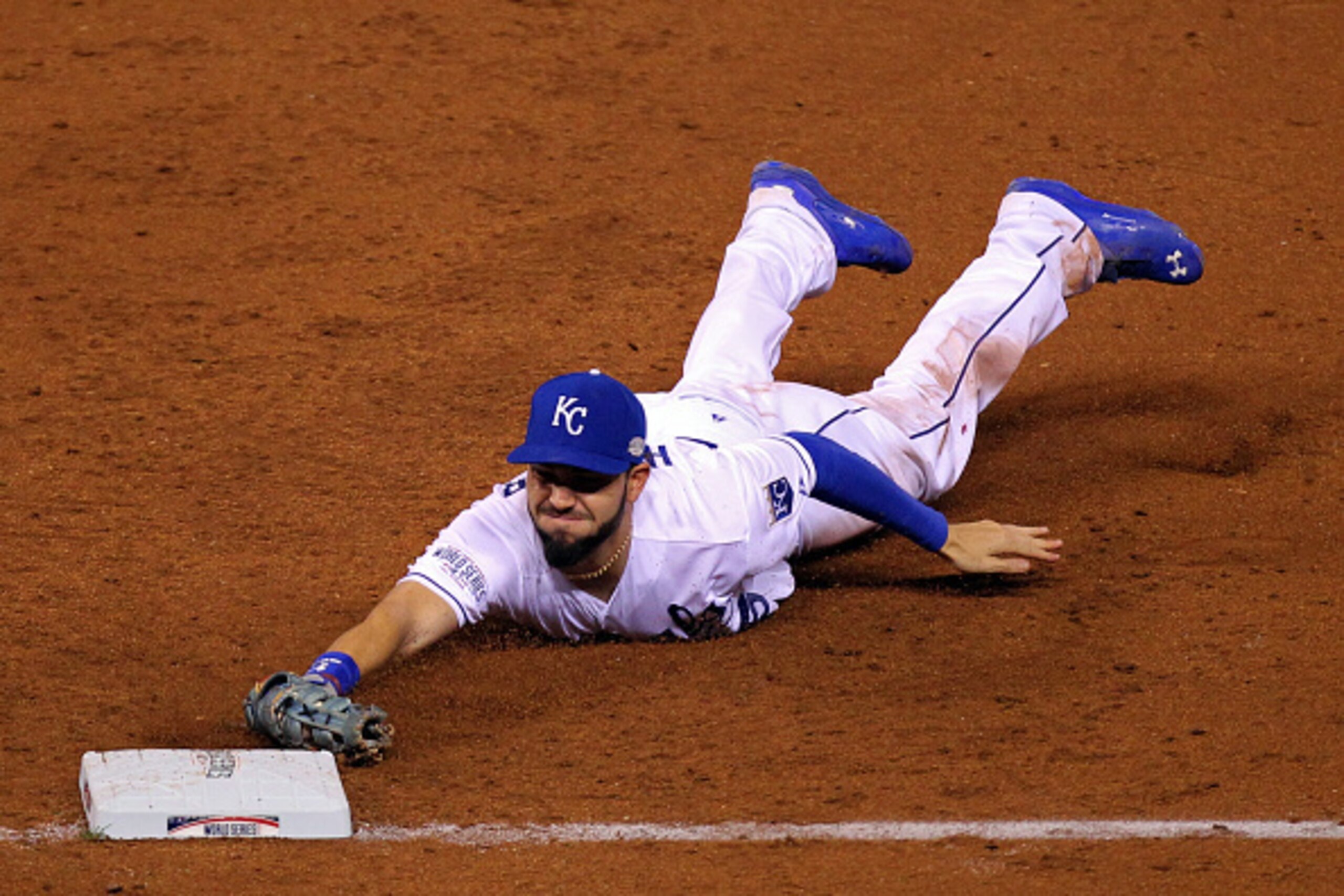 KANSAS CITY, MO - OCTOBER 22:  Eric Hosmer #35 of the Kansas City Royals dives to tag out Gregor Blanco #7 of the San Francisco Giants in the third inning during Game Two of the 2014 World Series at Kauffman Stadium on October 22, 2014 in Kansas City, Mis