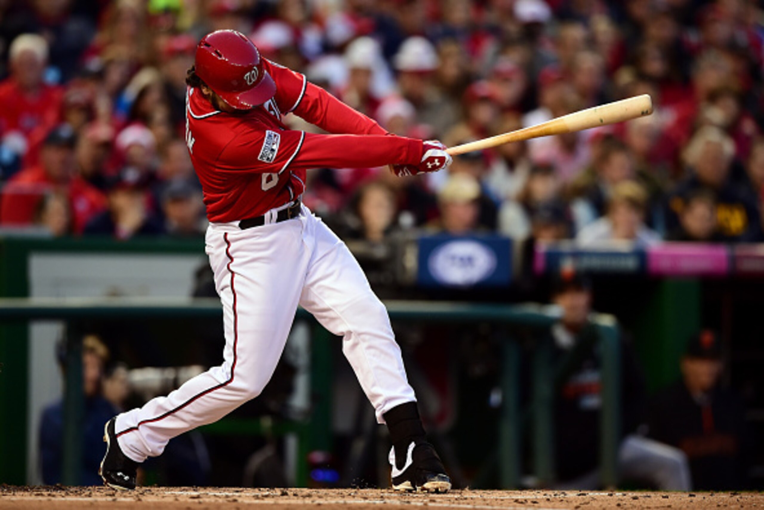 WASHINGTON, DC - OCTOBER 04:  Anthony Rendon #6 of the Washington Nationals hits an RBI single to left field to score Asdrubal Cabrera #3 in the third inning against Tim Hudson #17 of the San Francisco Giants during Game Two of the National League Divisio