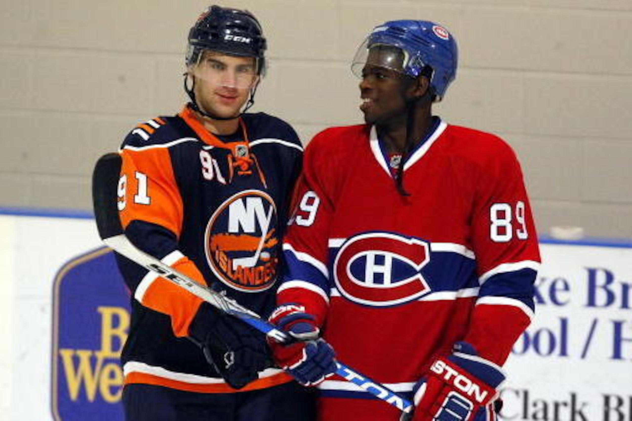MISSISSAUGA, CANADA - AUGUST 26:  John Tavares #91 of the New York Islanders laughs with P.K. Subban #89 of the Montreal Canadiens during the Upper Deck NHL Rookie Debut at the Hershey Centre August 26, 2009 in Mississauga, Ontario, Canada.  (Photo By Dav