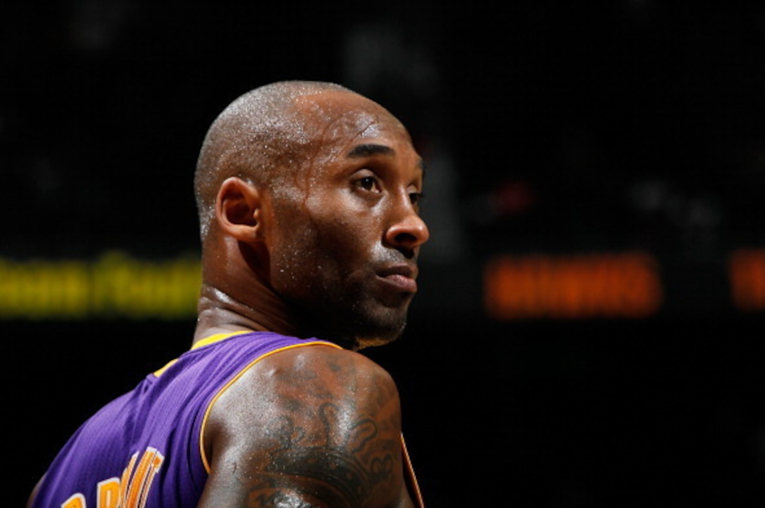 ATLANTA, GA - DECEMBER 16:  Kobe Bryant #24 of the Los Angeles Lakers looks on during free throws in the final mintues of their 114-100 loss to the Atlanta Hawks at Philips Arena on December 16, 2013 in Atlanta, Georgia.  NOTE TO USER: User expressly ackn