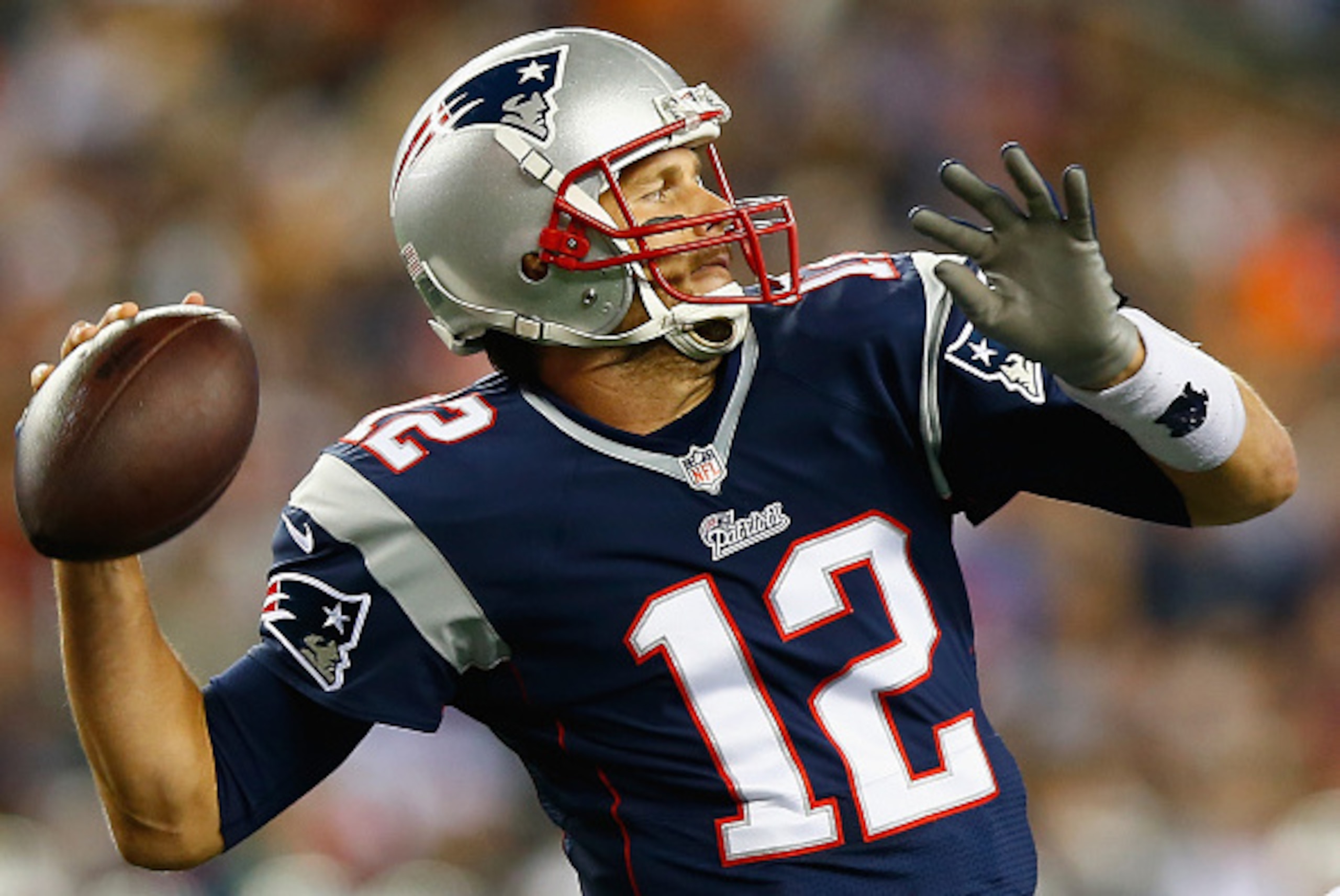 FOXBORO, MA - OCTOBER 16:  Tom Brady #12 of the New England Patriots passes the ball during the second quarter against the New York Jets at Gillette Stadium on October 16, 2014 in Foxboro, Massachusetts.  (Photo by Jared Wickerham/Getty Images)