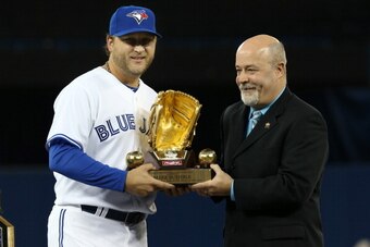 TORONTO, CANADA - APRIL 2: Mark Buehrle #56 of the Toronto Blue Jays is presented with the Gold Glove award before MLB game action against the Cleveland Indians during Opening Day on April 2, 2013 at Rogers Centre in Toronto, Ontario, Canada. (Photo by To